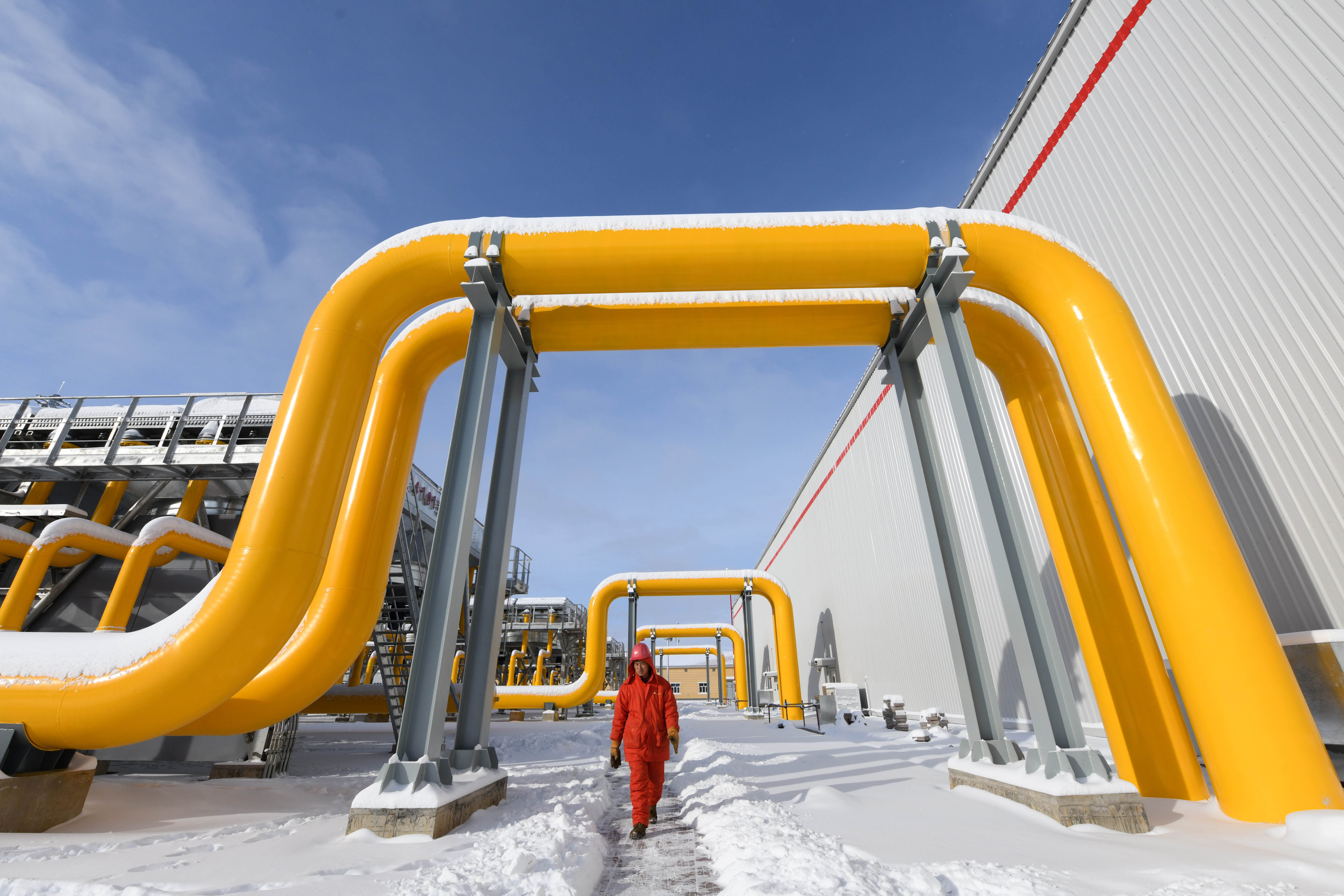 A worker walks past a section of the China-Russia east-route natural gas pipeline system in northeast China’s Heilongjiang province. The neighbouring countries are looking to further boost their energy cooperation. Photo: Xinhua