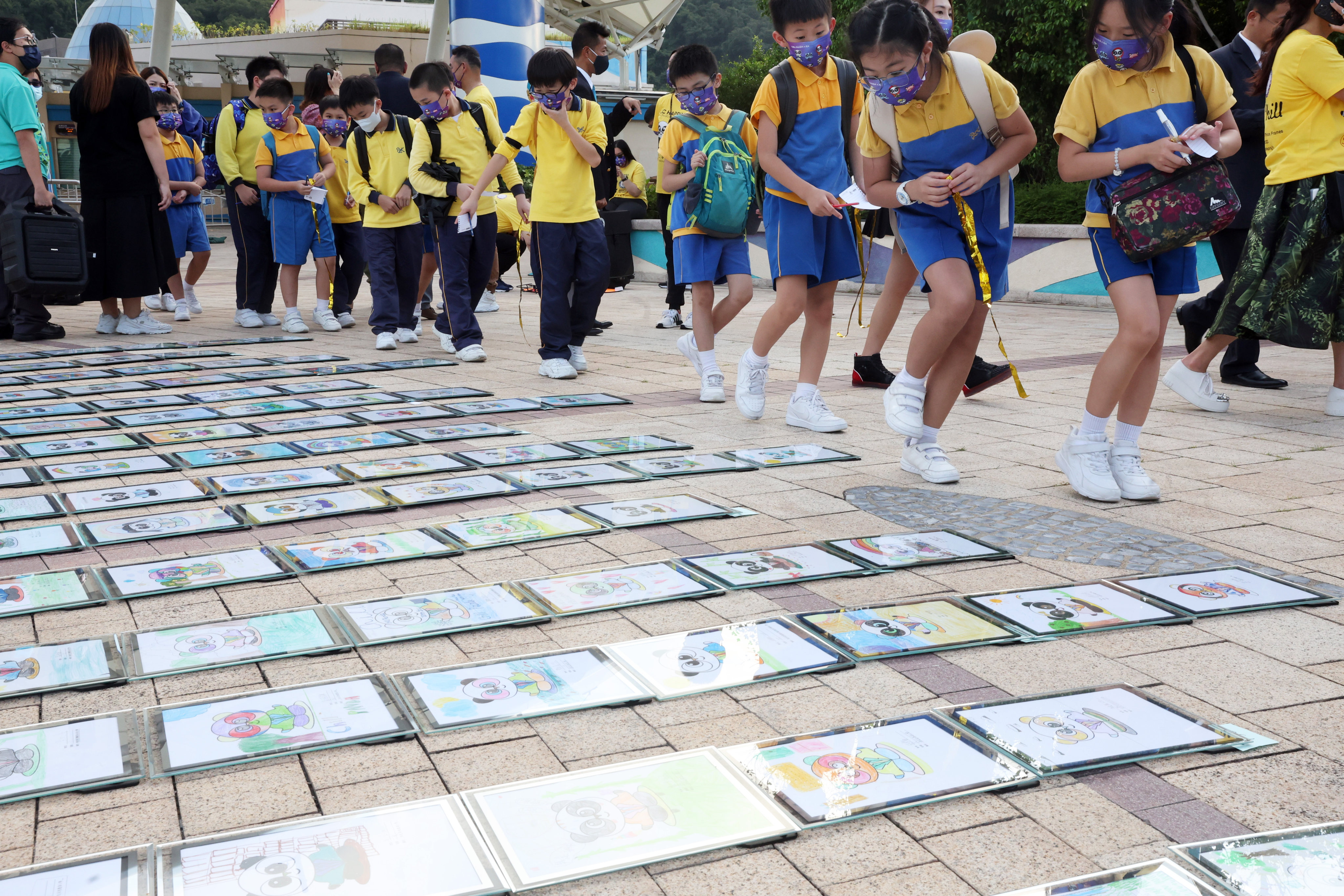 Children take part in setting a World Guinness record for the largest display of picture frames, in an event to raise mental health awareness, at Ocean Park on November 16. We need to have earlier conversations about mental health with both students and parents to destigmatise the taboo of mental disorders. Photo: Edmond So