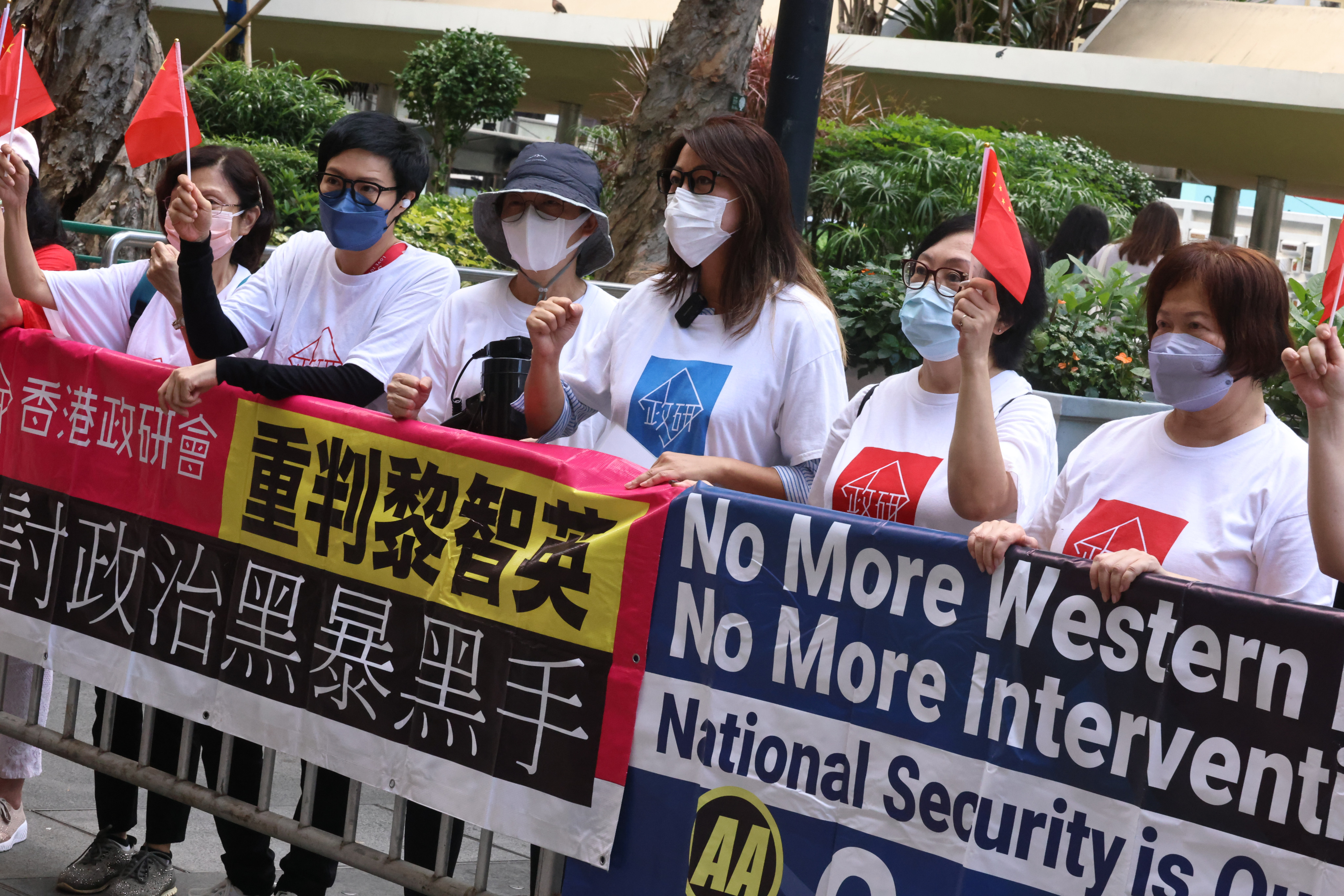 Politihk Social Strategic members protest against the decision by Hong Kong’s top court to allow Apple Daily founder Jimmy Lai to have British King’s Counsel Timothy Owen represent him, on November 28, outside the Court of Final Appeal in Central. Photo: K.Y. Cheng