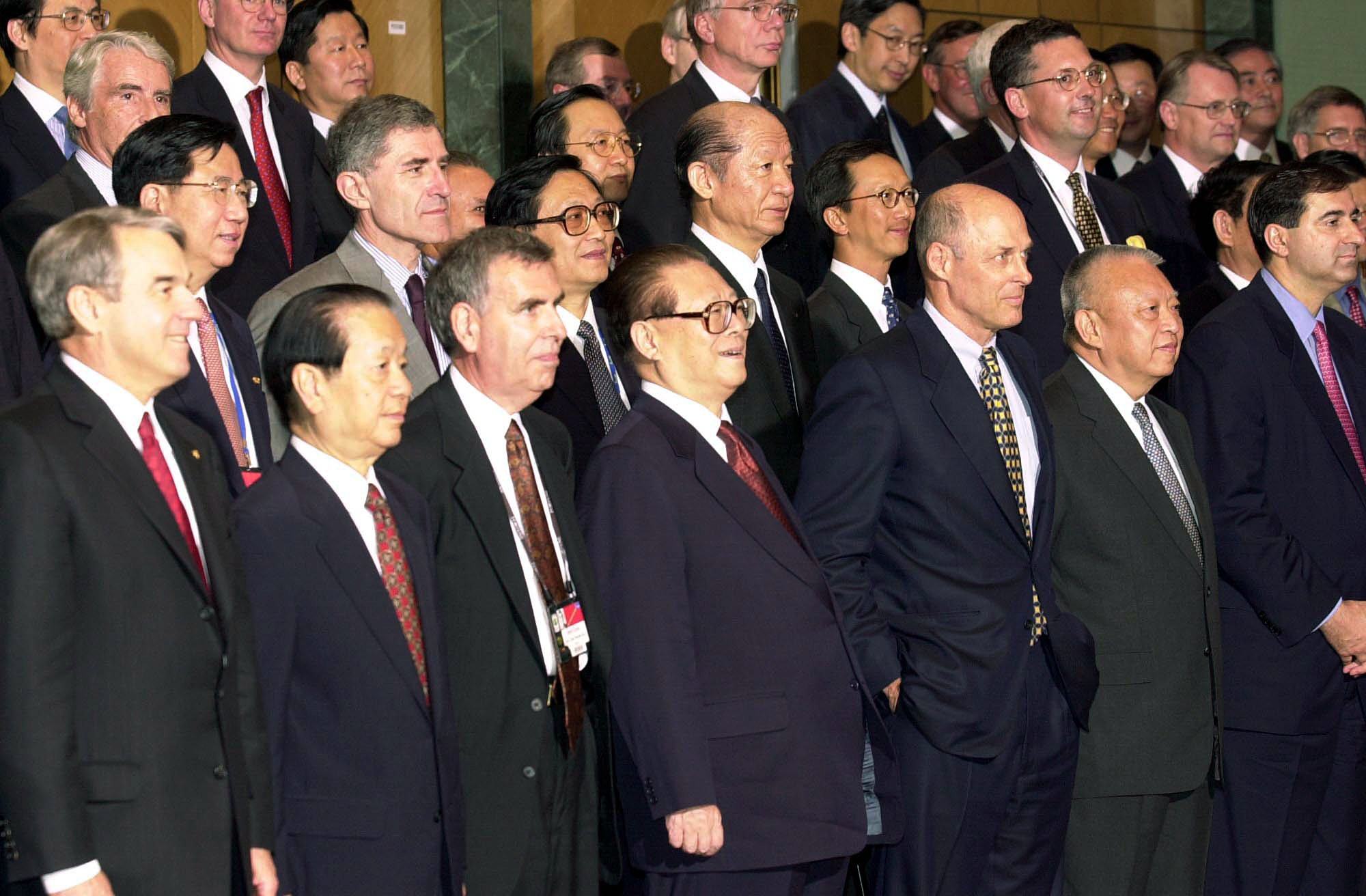 Then-president Jiang Zemin (front row, centre) and chief executive Tung Chee-hwa (front row, second from right) take part in a photo session with delegates at the Fortune Global Forum on May 8, 2001, at the Hong Kong Convention and Exhibition Centre. Photo: Handout