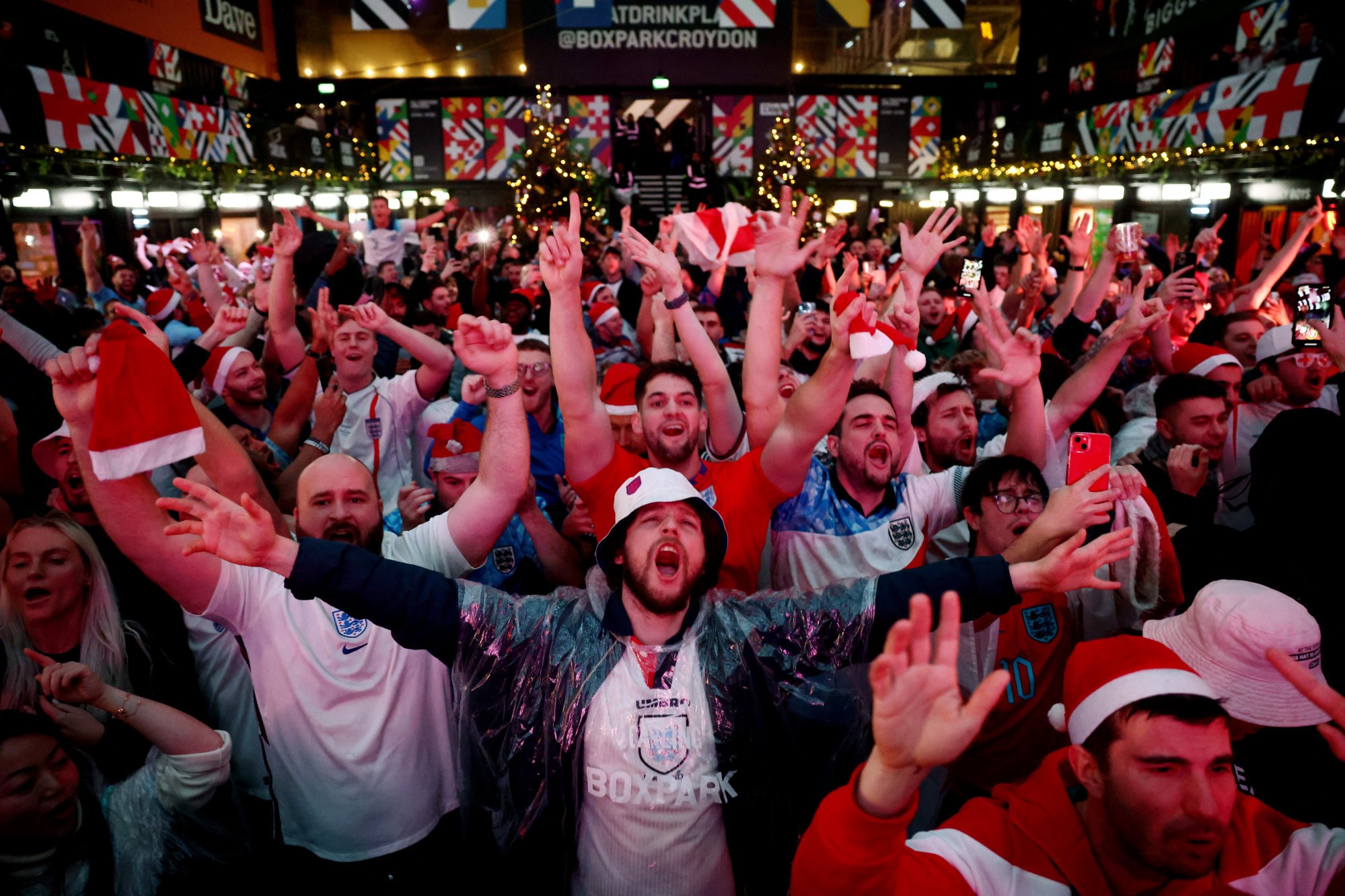 Fans gather in Croydon, London to watch England v Senegal on Sunday. Photo: Reuters