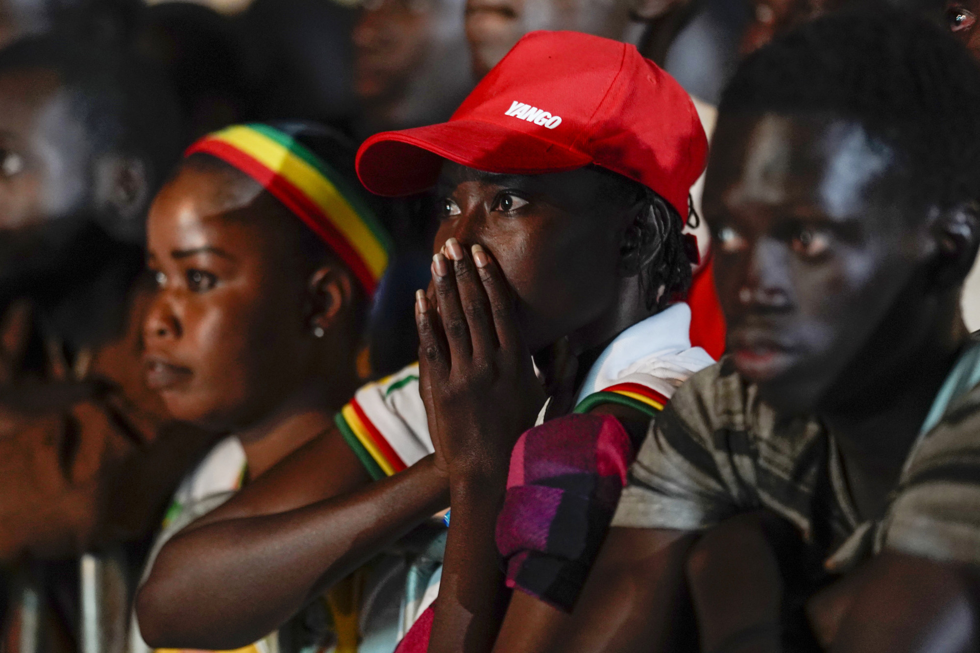 Senegal fans watch their team’s World Cup match against England on a video screen set up at a fan zone in Dakar, Senegal on Sunday. Photo: AP