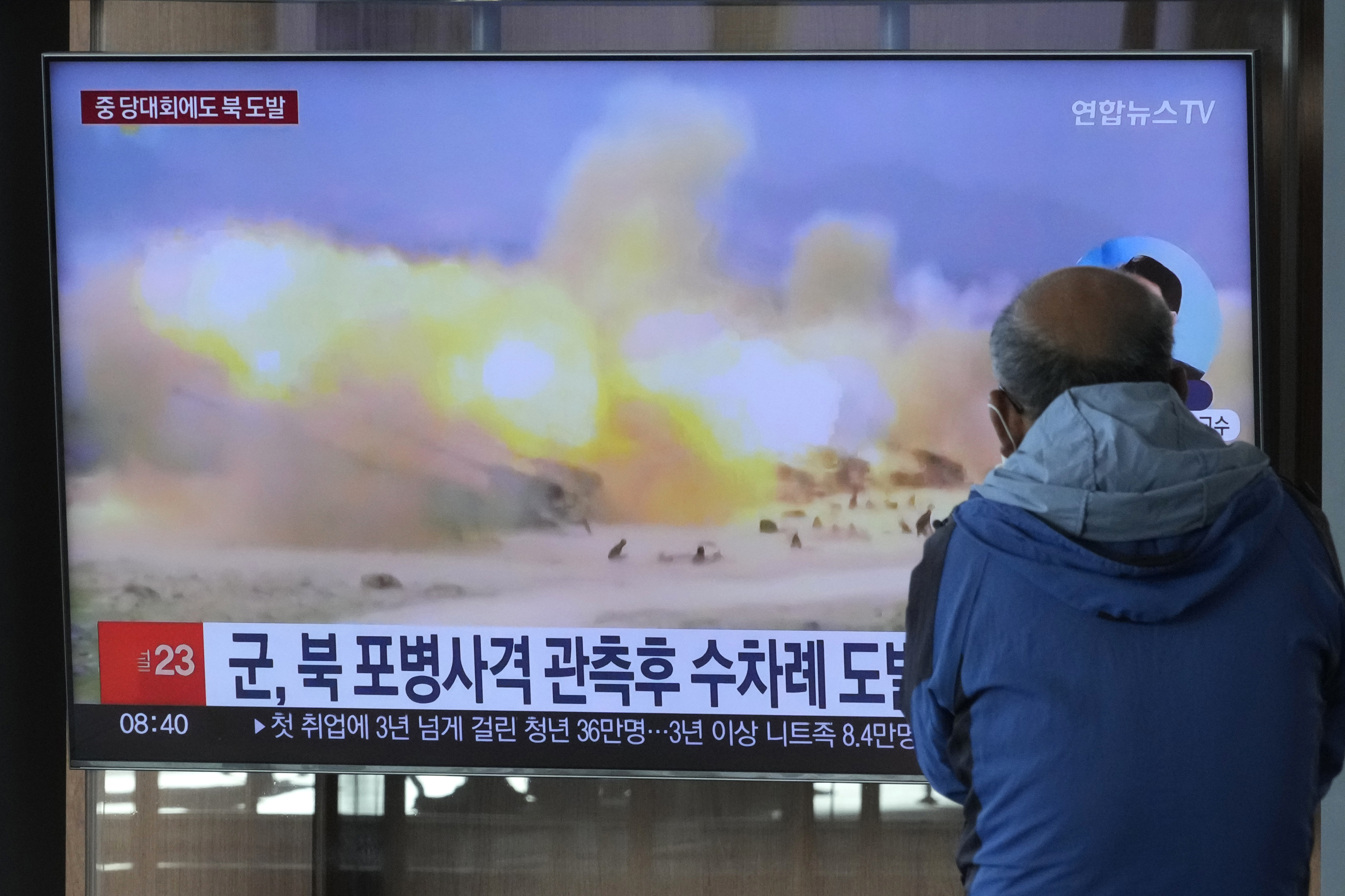 A TV screen shows a file image of North Korea’s military exercise during a news program at the Seoul Railway Station on October 19, 2022. South Korea’s military said North Korea fired about 130 suspected artillery rounds on Monday into the water near their western and eastern sea borders, the latest military action contributing to worsening relations between the neighbours. Photo: AP