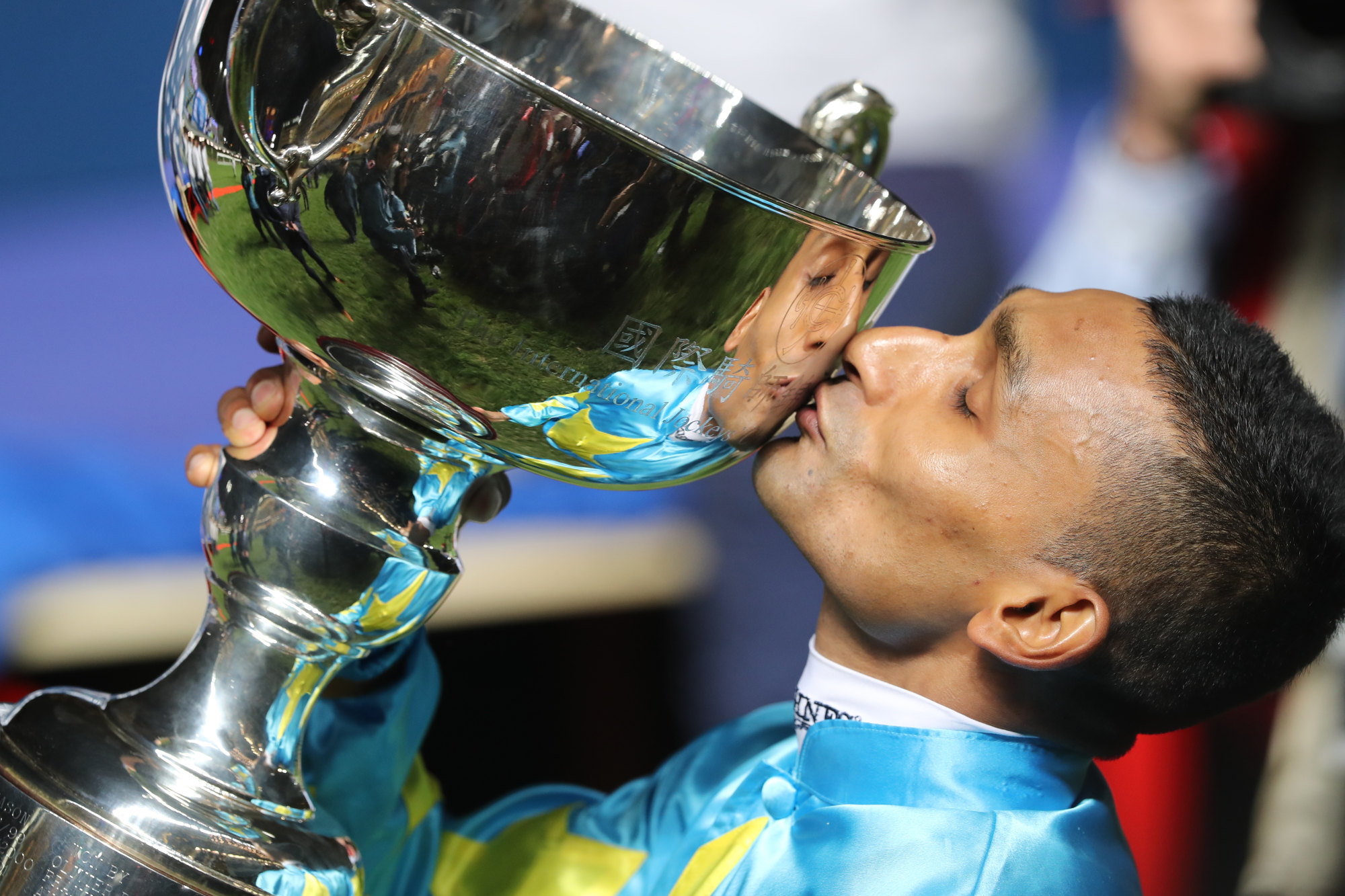 Winning rider Karis Teetan kisses the 2019 International Jockeys’ Championship trophy.