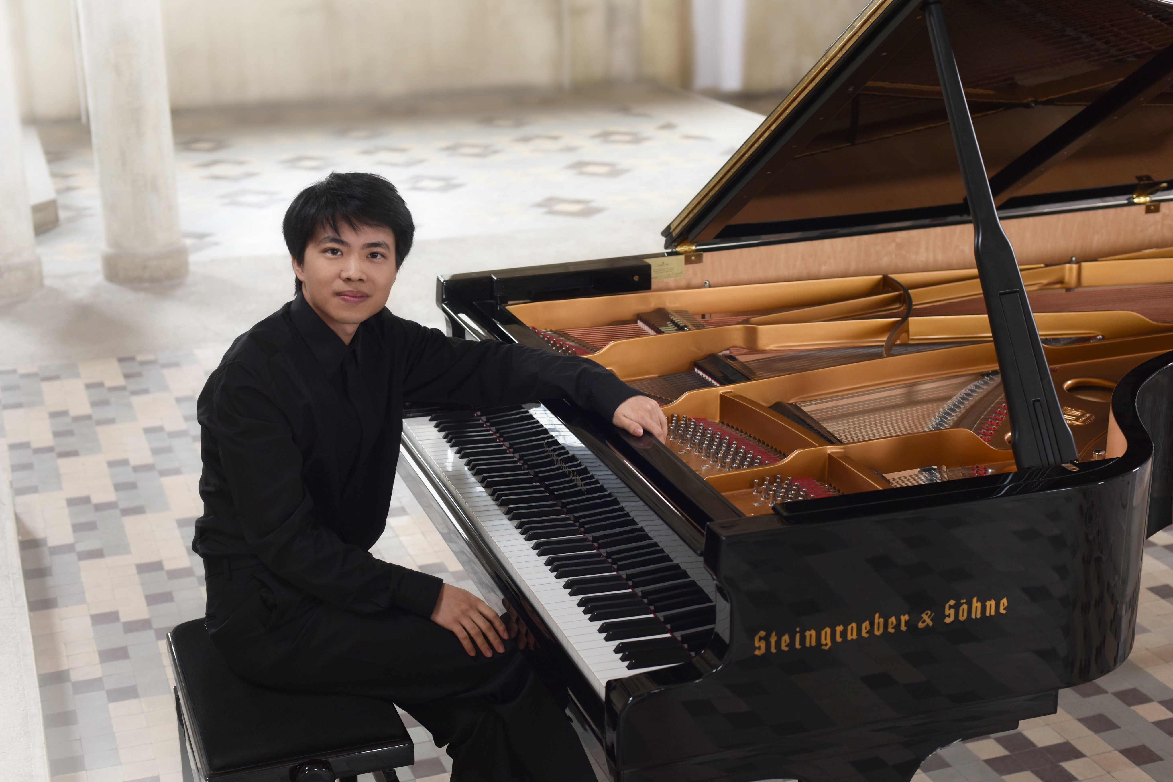 Los Angeles-born former child prodigy Kit Armstrong photographed with his grand piano in the church in northern France that has been his home since 2012. He performs in Hong Kong on December 11. Photo: Courtesy of Kit Armstrong