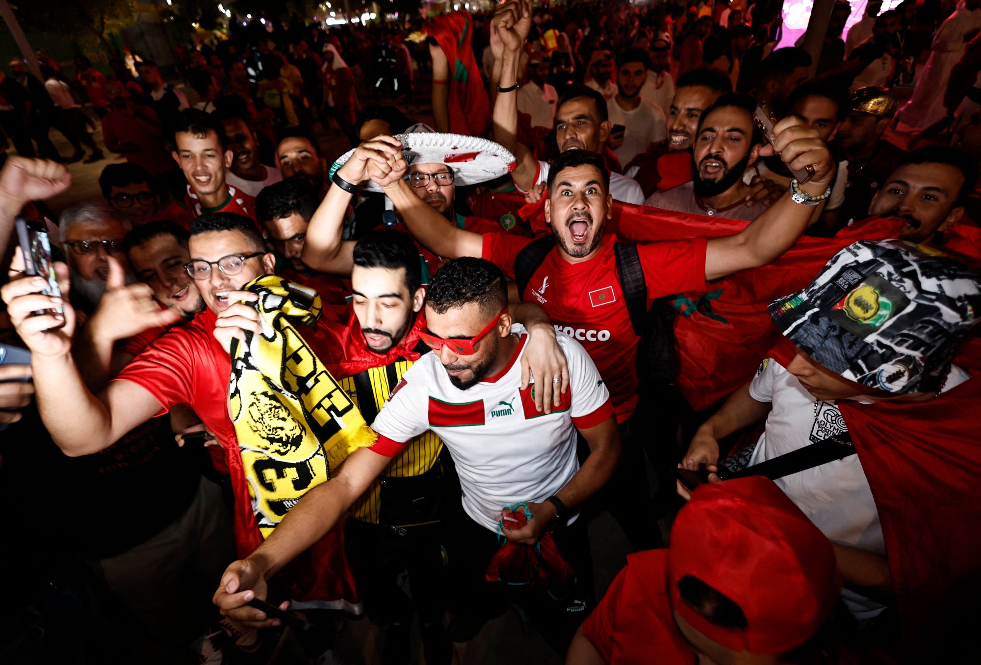 Morocco fans celebrate outside the stadium on Tuesday after the penalty shoot-out as Morocco progress to the World Cup quarter finals. Photo: Reuters