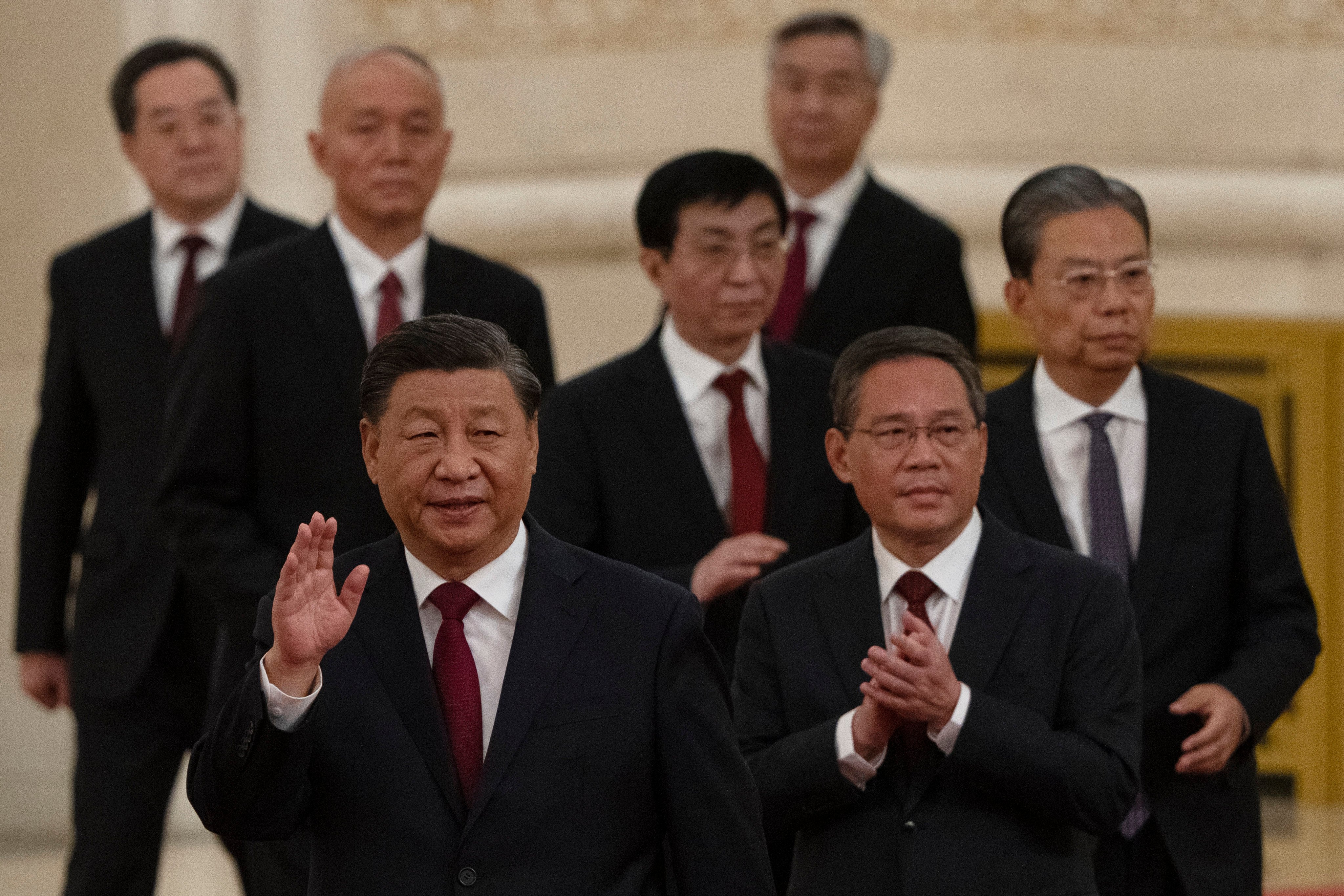 President Xi Jinping is joined by Politburo members (from front to back) Li Qiang, Zhao Leji, Wang Huning, Cai Qi, Ding Xuexiang and Li Xi, at the Great Hall of the People in Beijing on October 23. Photo: AP