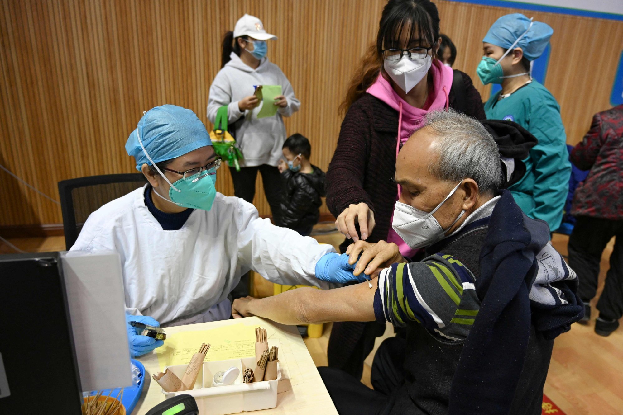 A resident of Guangzhou receives a Covid-19 vaccine on December 6. Photo: CNS/AFP