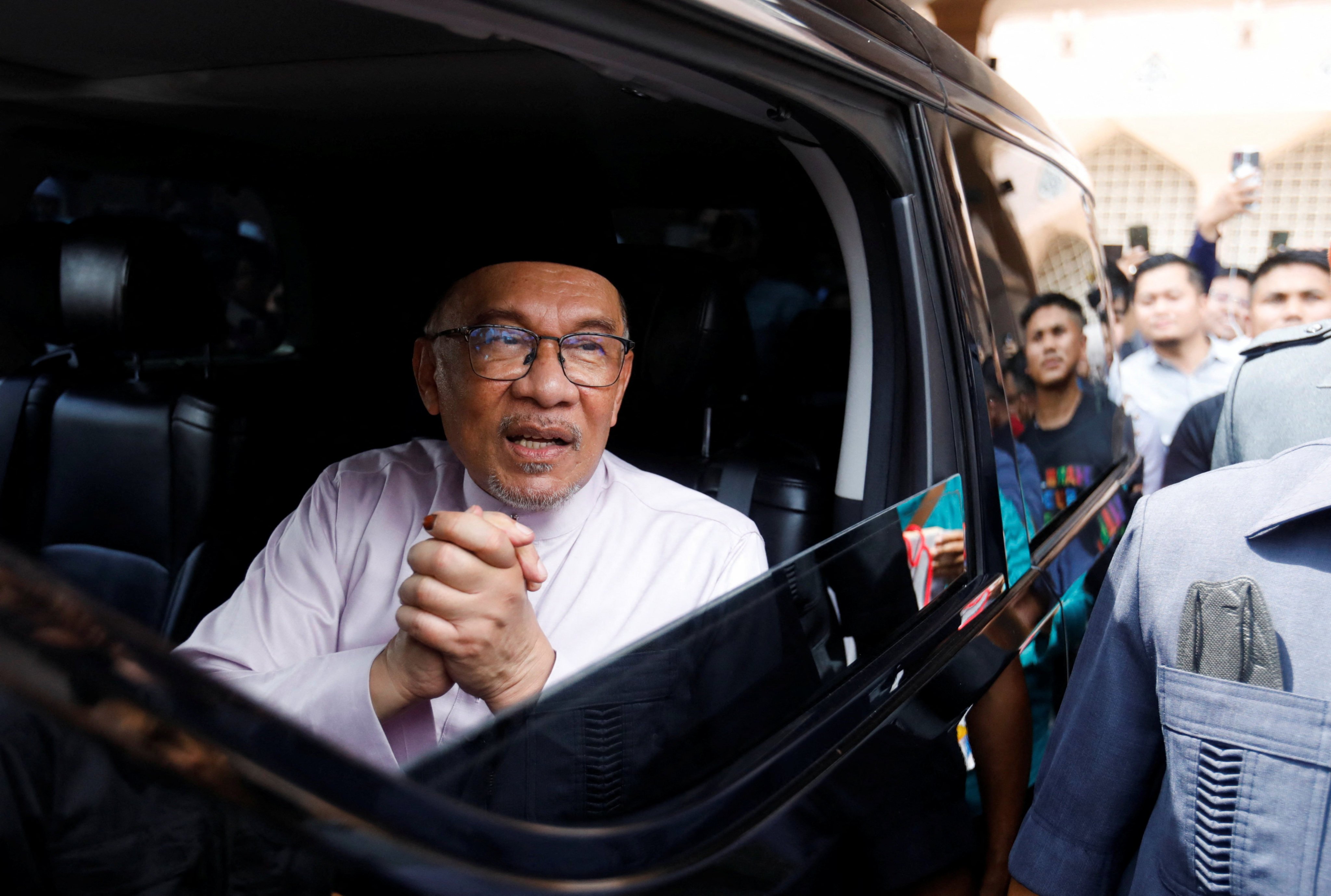 Malaysia’s Prime Minister Anwar Ibrahim meets supporters during his first public appearance. Photo: Reuters