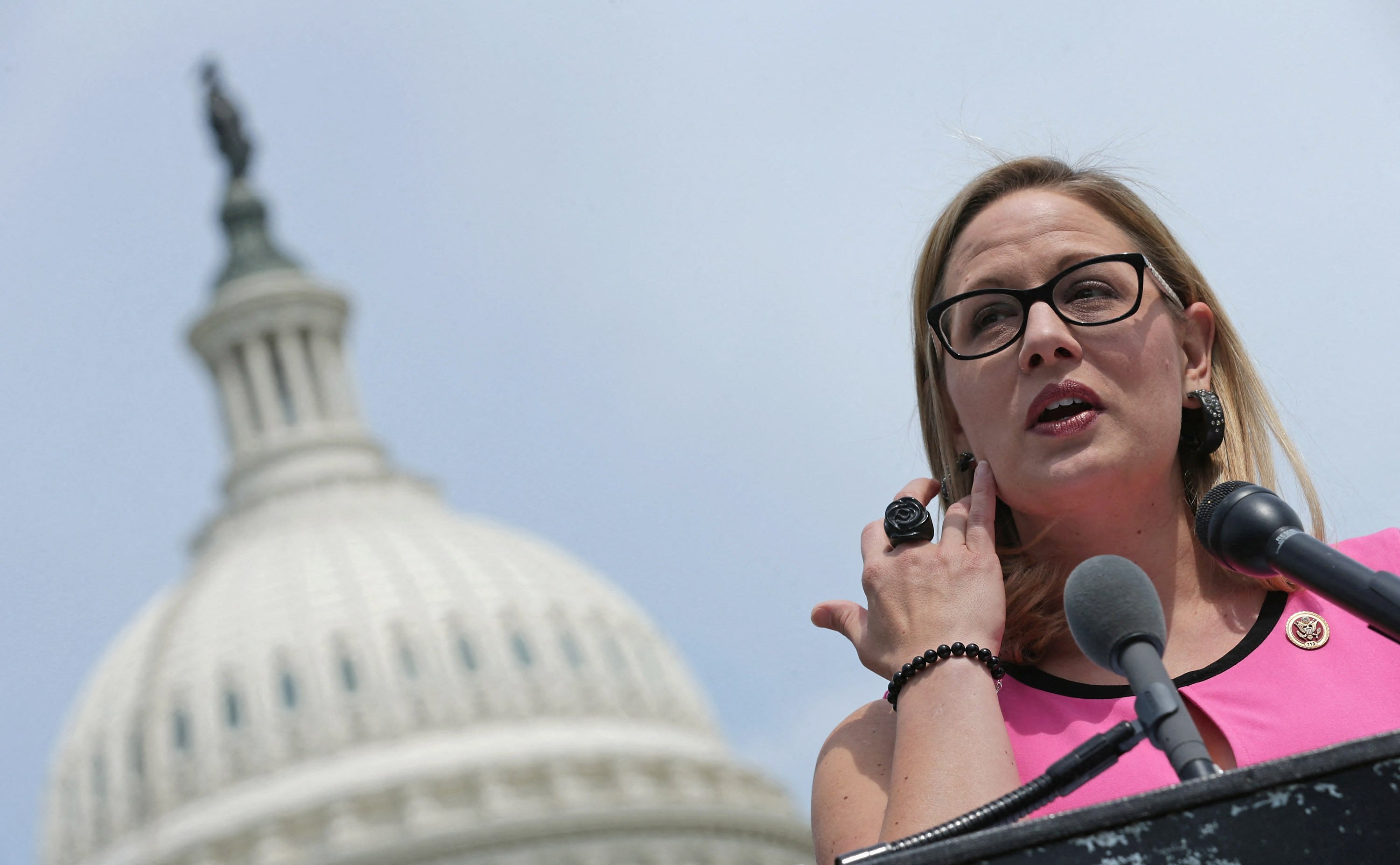 US lawmaker Kyrsten Sinema speaks at a news conference outside the Capitol in May 2014. Photo: AFP