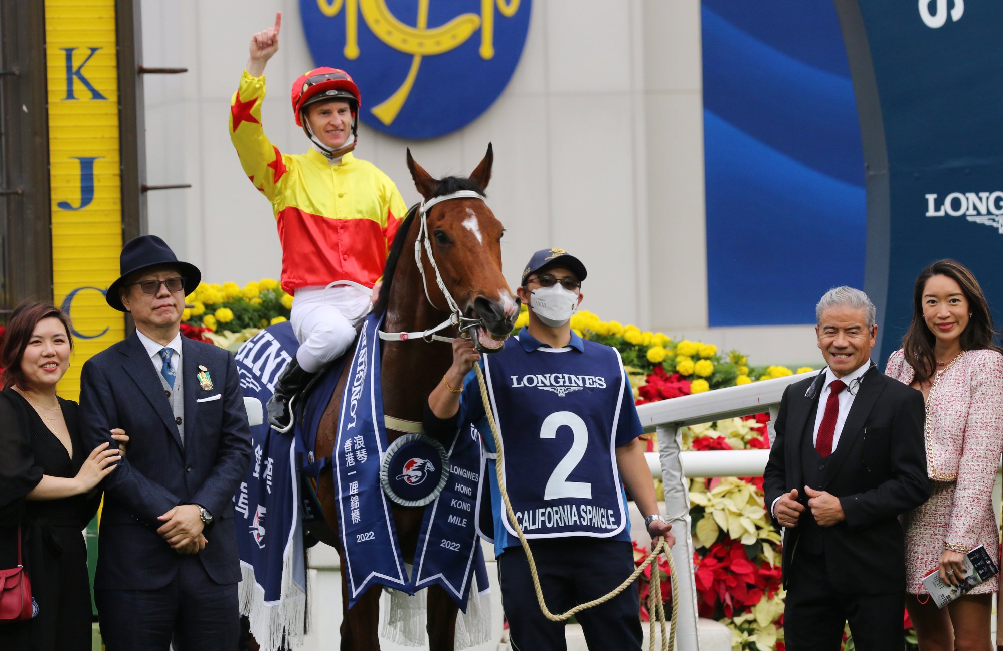 California Spangle’s connections, including Zac Purton and Tony Cruz, celebrate his Hong Kong Mile victory.