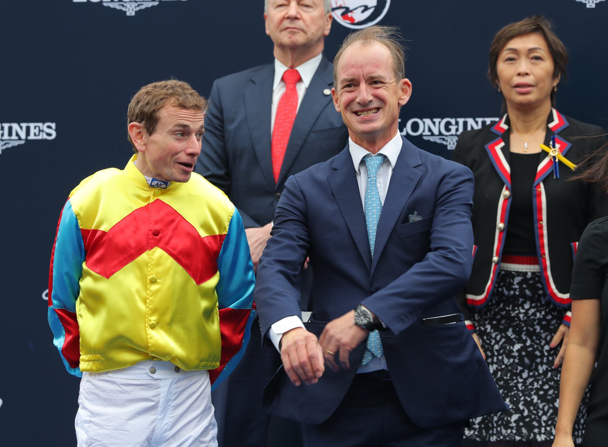Wellington’s jockey Ryan Moore and trainer Richard Gibson are all smiles during the Hong Kong Sprint presentation.
