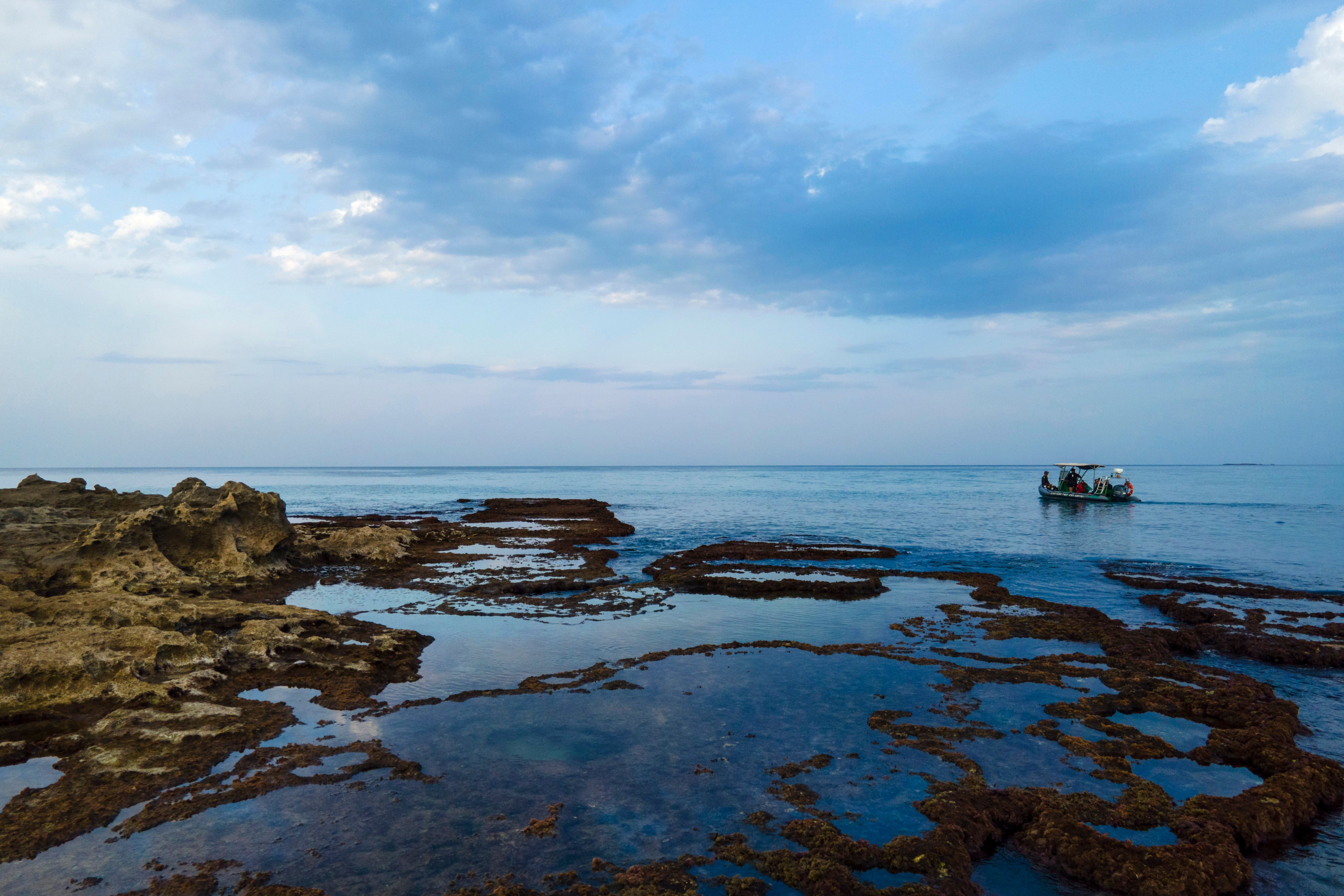 A boat, with marine protected areas officials, moves in the Mediterranean Sea marine natural reserve of Rosh Hanikra in northern Israel on October 26. Half of world GDP is generated by sectors – from agriculture and lumber to fisheries – that are moderately or highly dependent on ecosystems. These vital natural assets shouldn’t be compromised. Photo: AP 