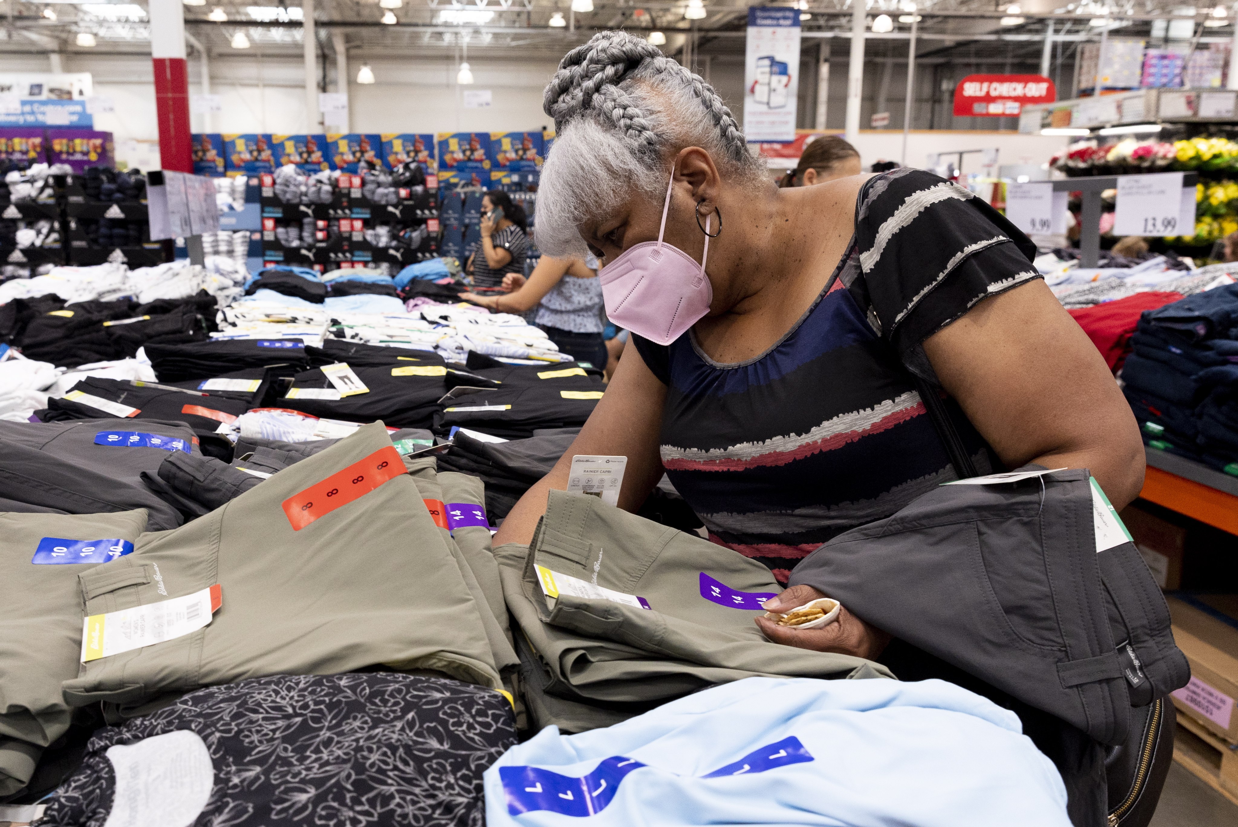 Customers look at clothing, some produced in China, at a Costco in Washington on July 6. The first wave of Trump-era tariffs on Chinese goods began four years ago. Photo: EPA-EFE