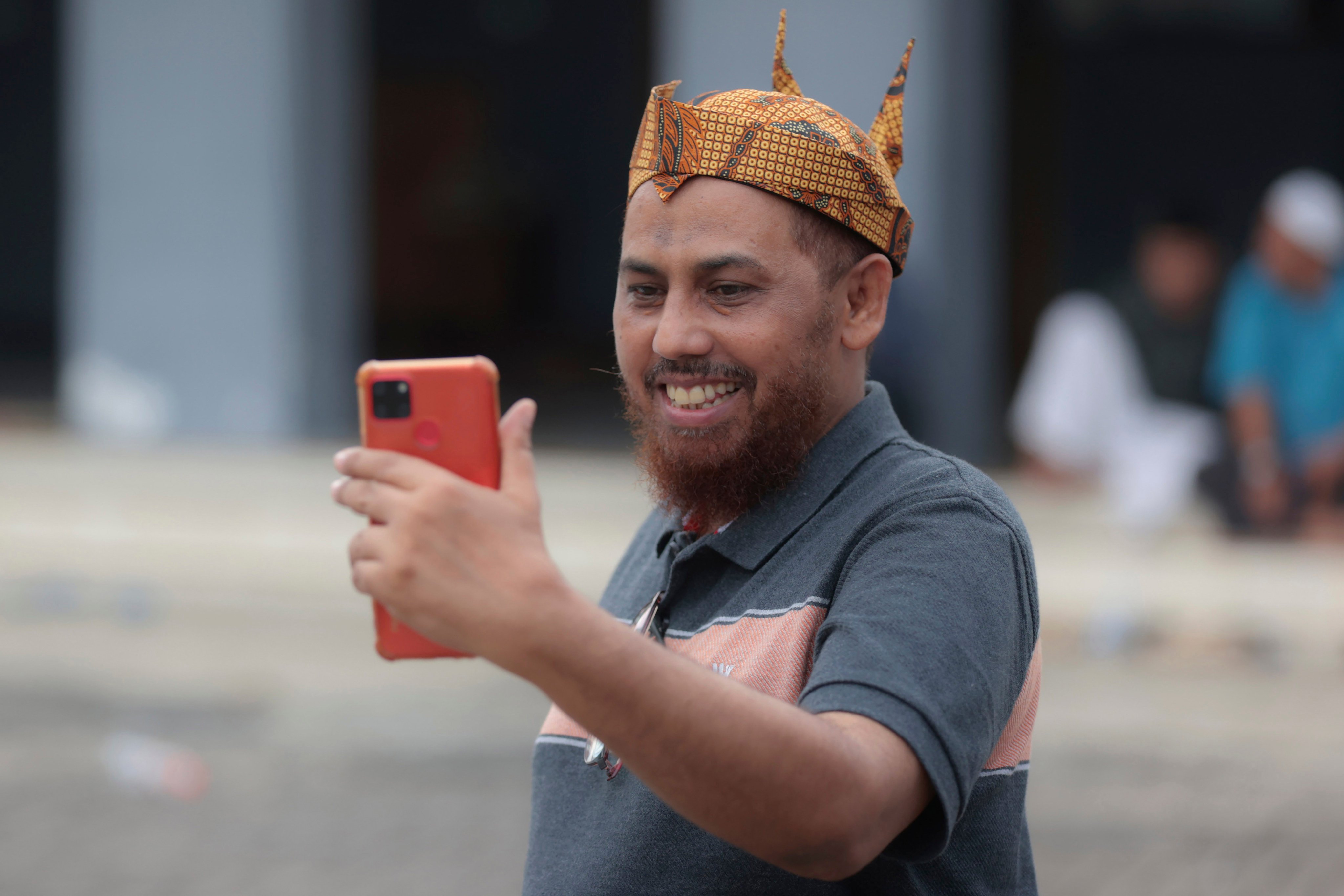 Hisyam bin Alizein, better known by his nom de guerre Umar Patek, makes a video call on Tuesday in Lamongan, Indonesia. Photo: AP