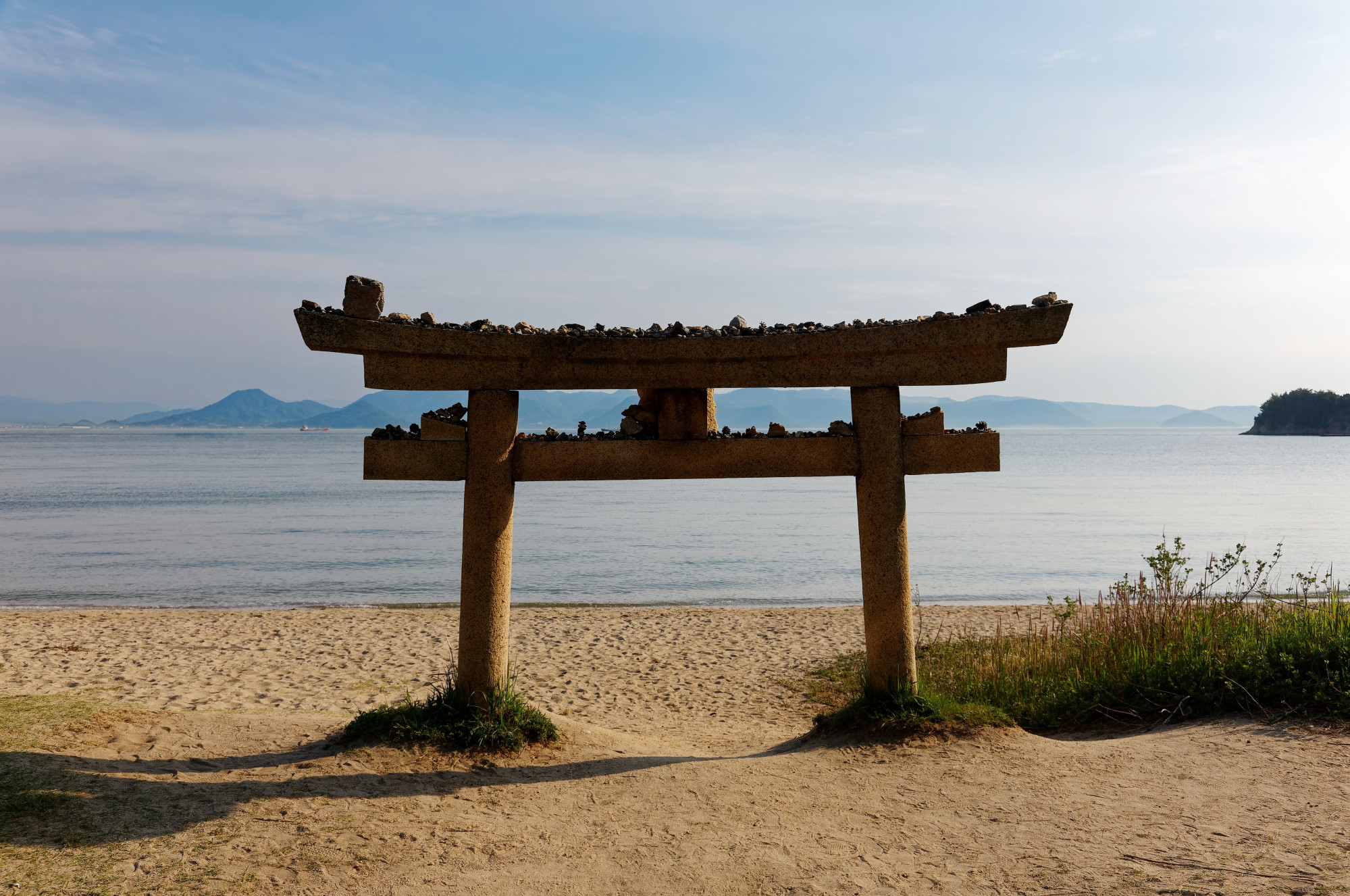 The Torii Gate on Naoshima’s sandy beach, in Kagawa, Shikoku, Japan. Photo: Shutterstock