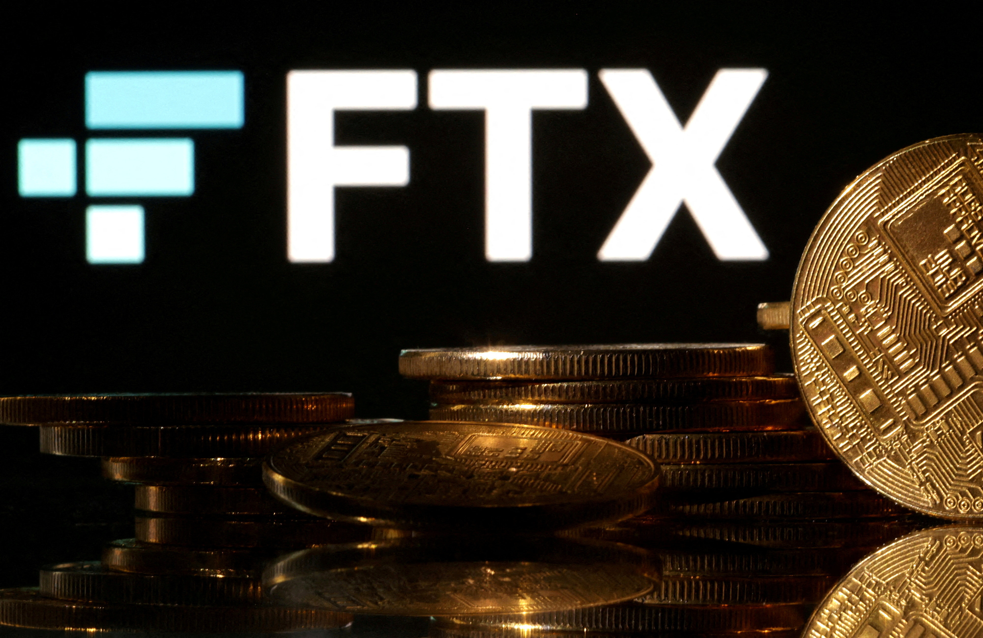 Representations of cryptocurrencies are seen in front of a displayed FTX logo in this illustration taken November 10, 2022. Photo: Reuters