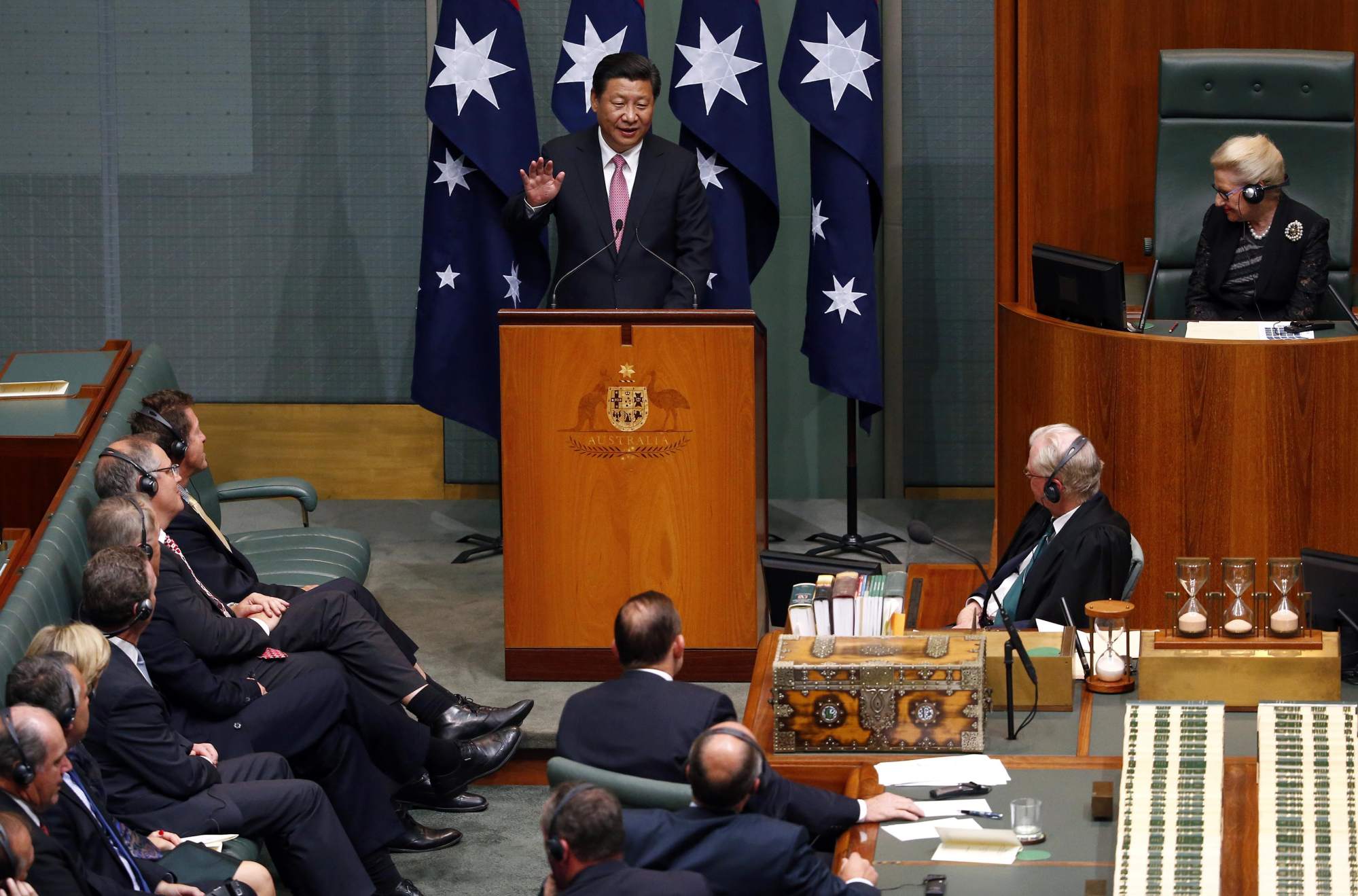 Australian prime minister Tony Abbott (centre) and other members of parliament listen at Parliament House in Canberra on November 17, 2014, as Chinese President Xi Jinping speaks, after the two countries signed a declaration of intent on a landmark free trade deal. Photo: Reuters