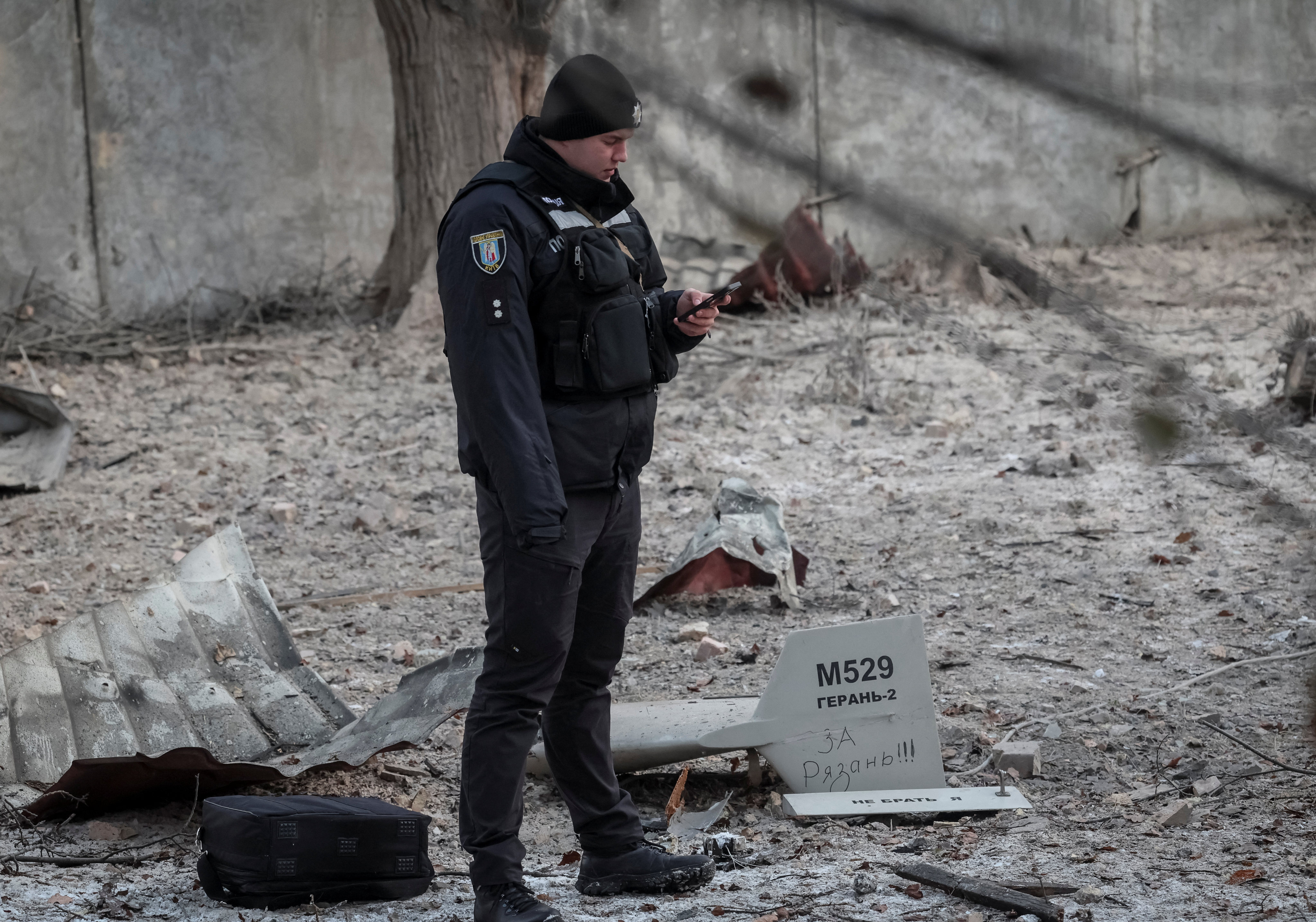 Parts of a drone at a location in Kyiv that was hit in a Russian attack last Wednesday. The inscription reads ‘For Ryazan’.  Photo: Reuters
