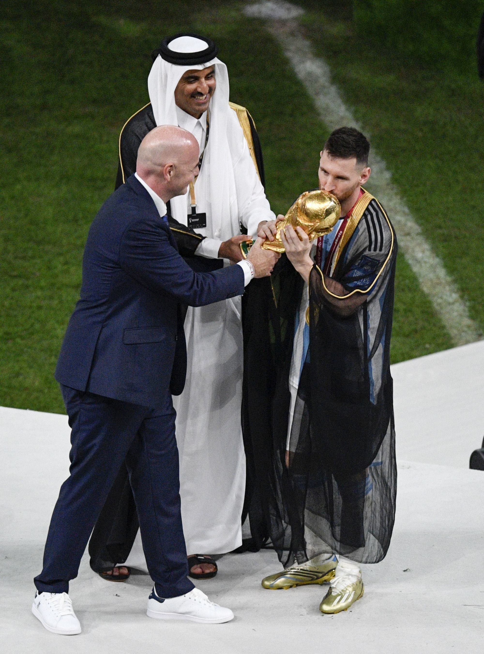 Lionel Messi made to wear traditional Arab robe for World Cup trophy lift