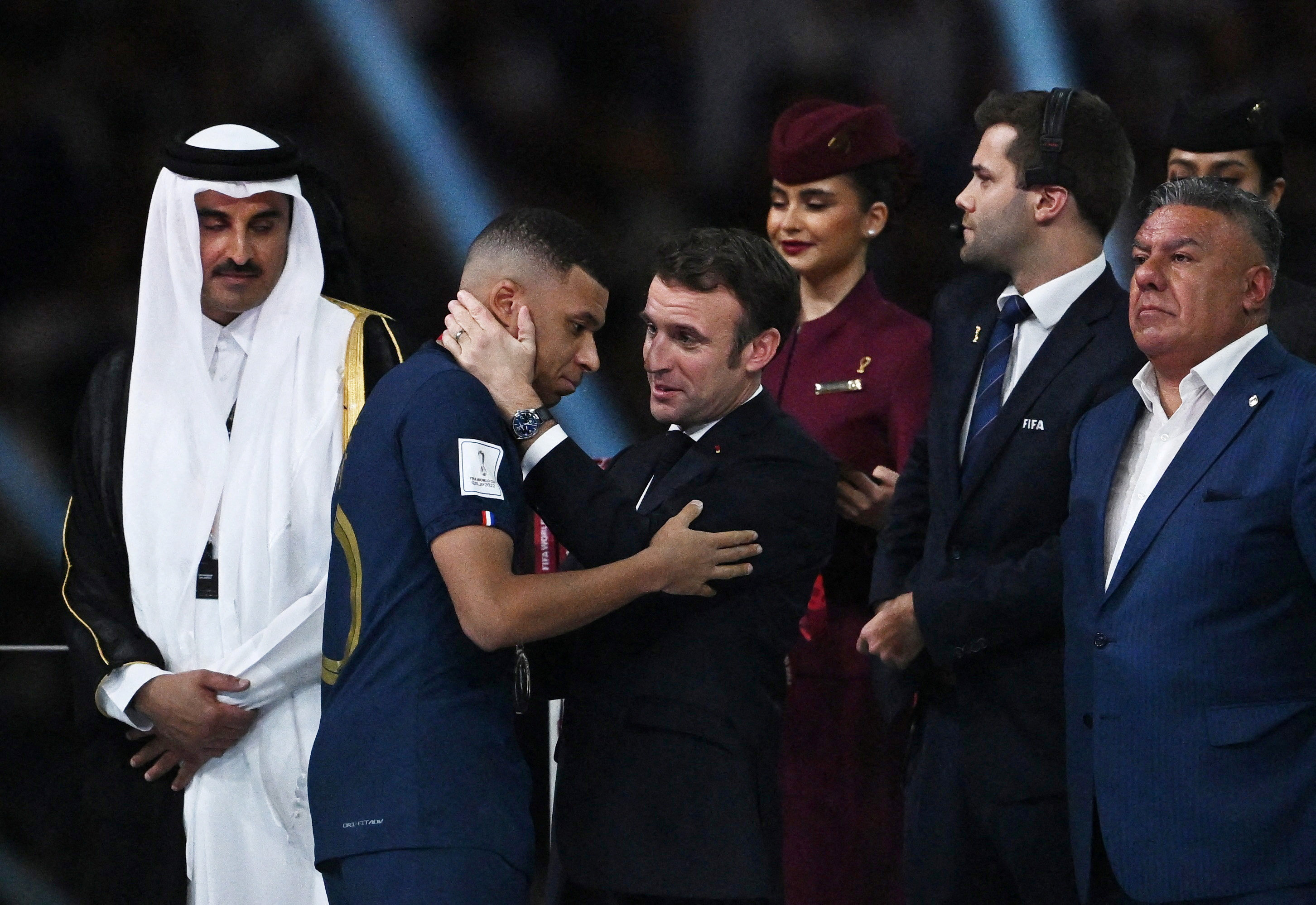 French President Emmanuel Macron with France’s Kylian Mbappe as President of the Argentine Football Association Claudio Fabian Tapia and the Emir of Qatar Sheikh Tamim bin Hamad Al Thani look on during the trophy ceremony. Photo: Reuters