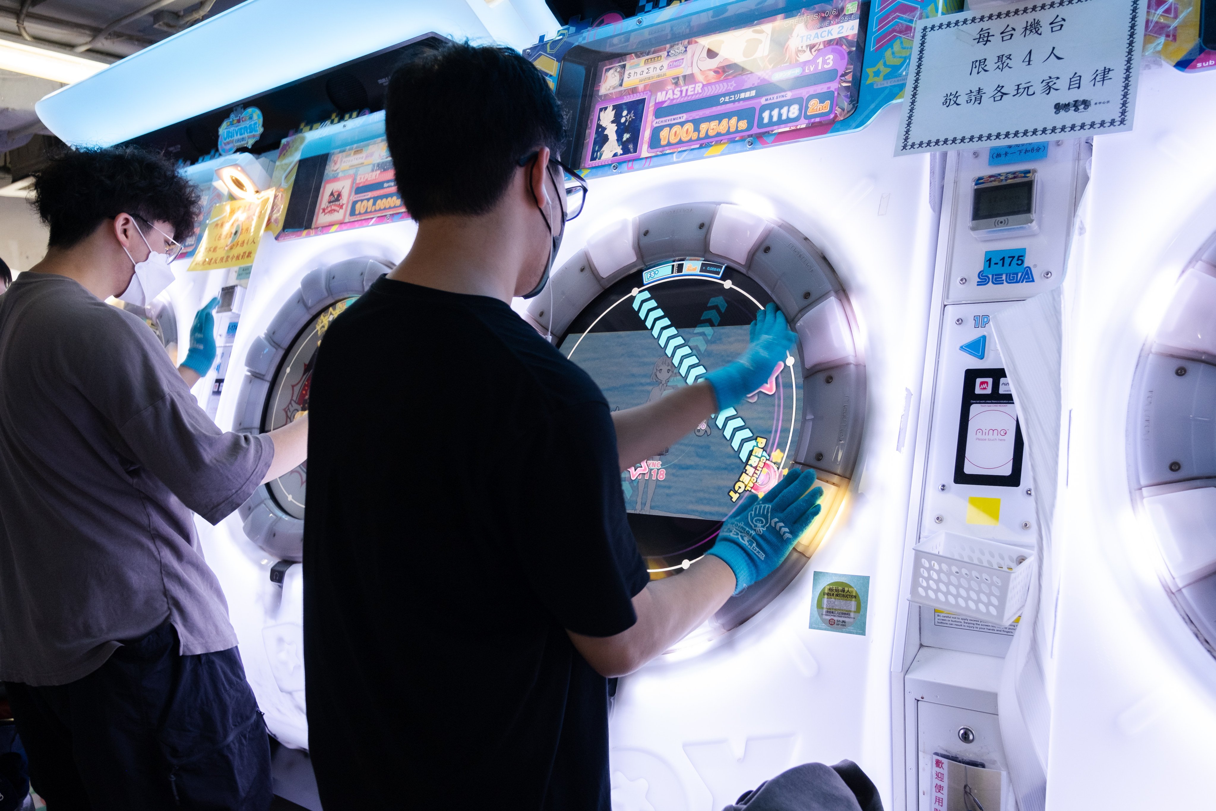 People play “Maimai DX Universe Plus” at a games arcade in Mong Kok, Hong Kong.
