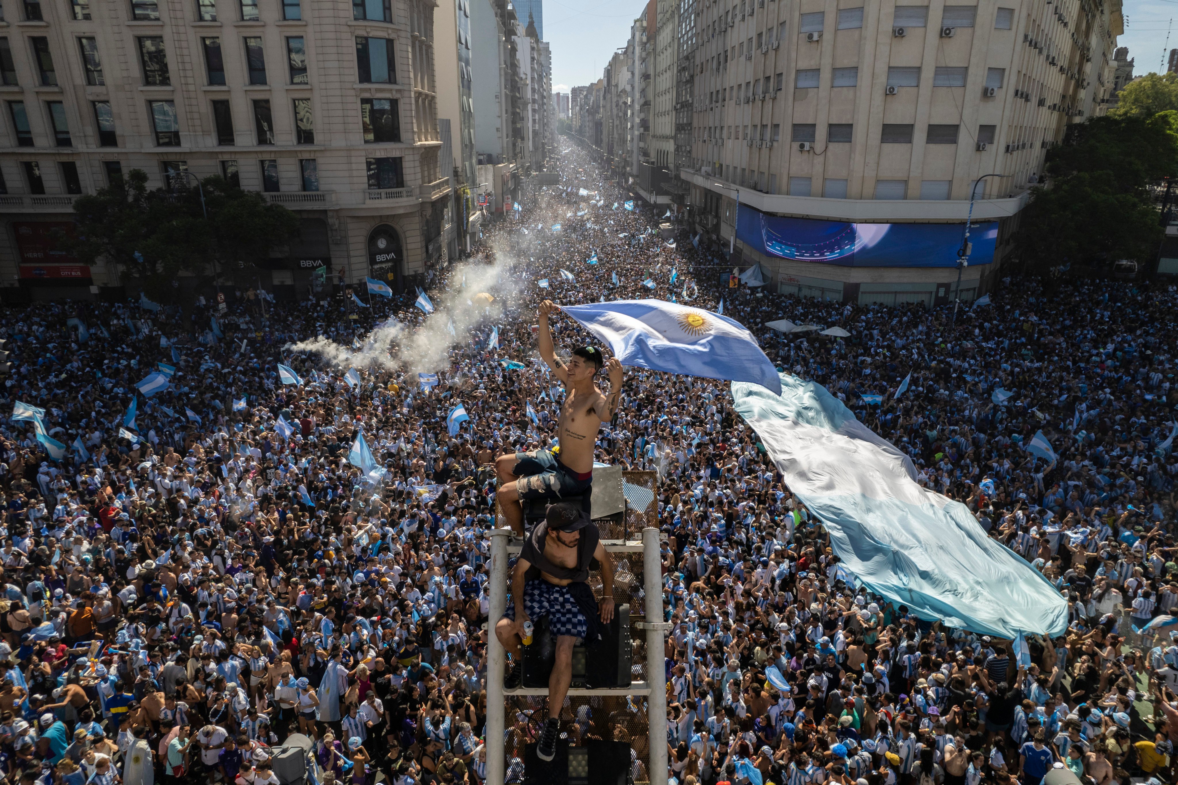 Argentine football fans descend on the capital’s Obelisk to celebrate their team’s World Cup victory over France, in Buenos Aires, Argentina on Sunday. Photo: AP