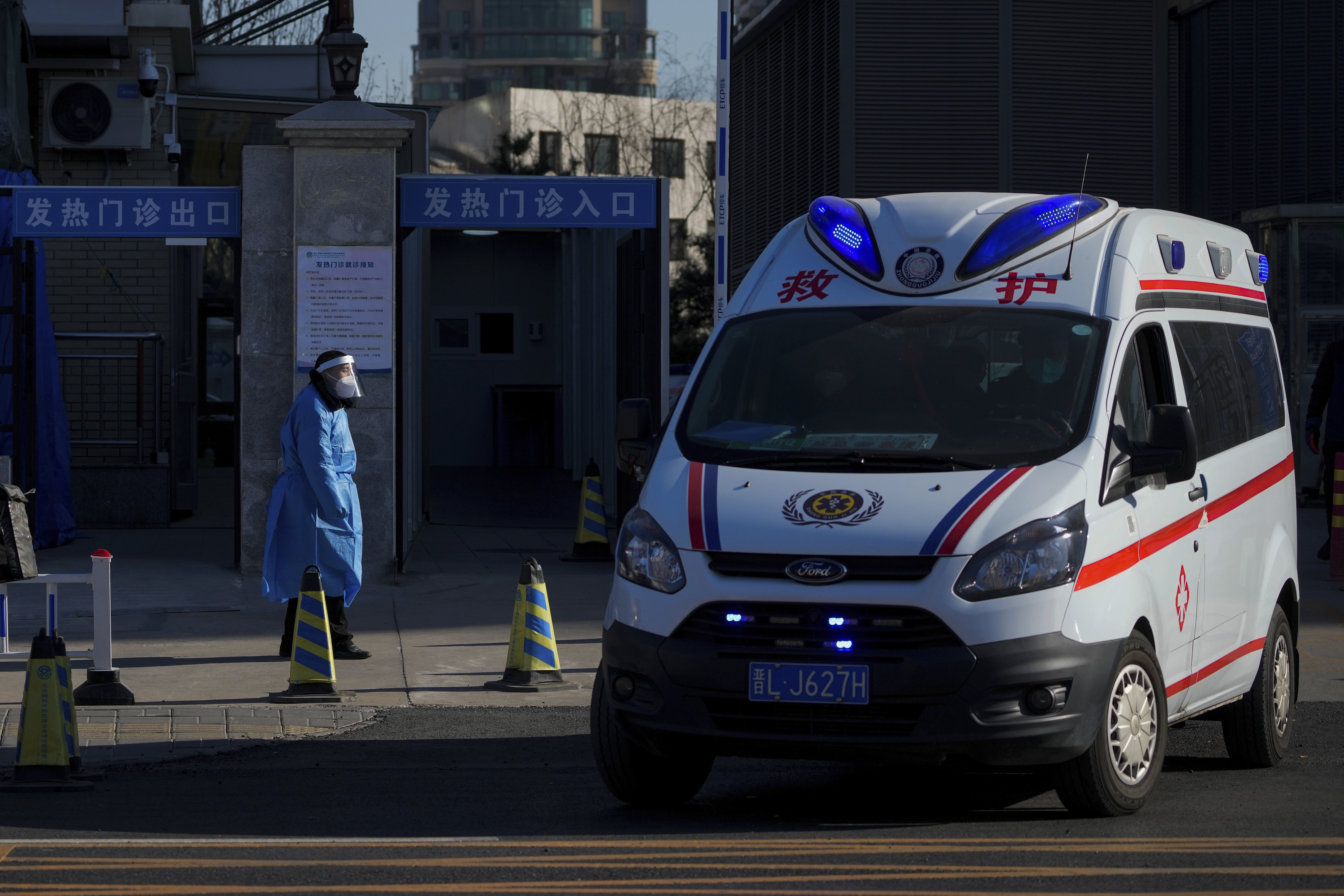 An ambulance outside a fever clinic in Beijing on Monday. China has reported the first Covid-related deaths in weeks amid a surge in cases. Photo: AP