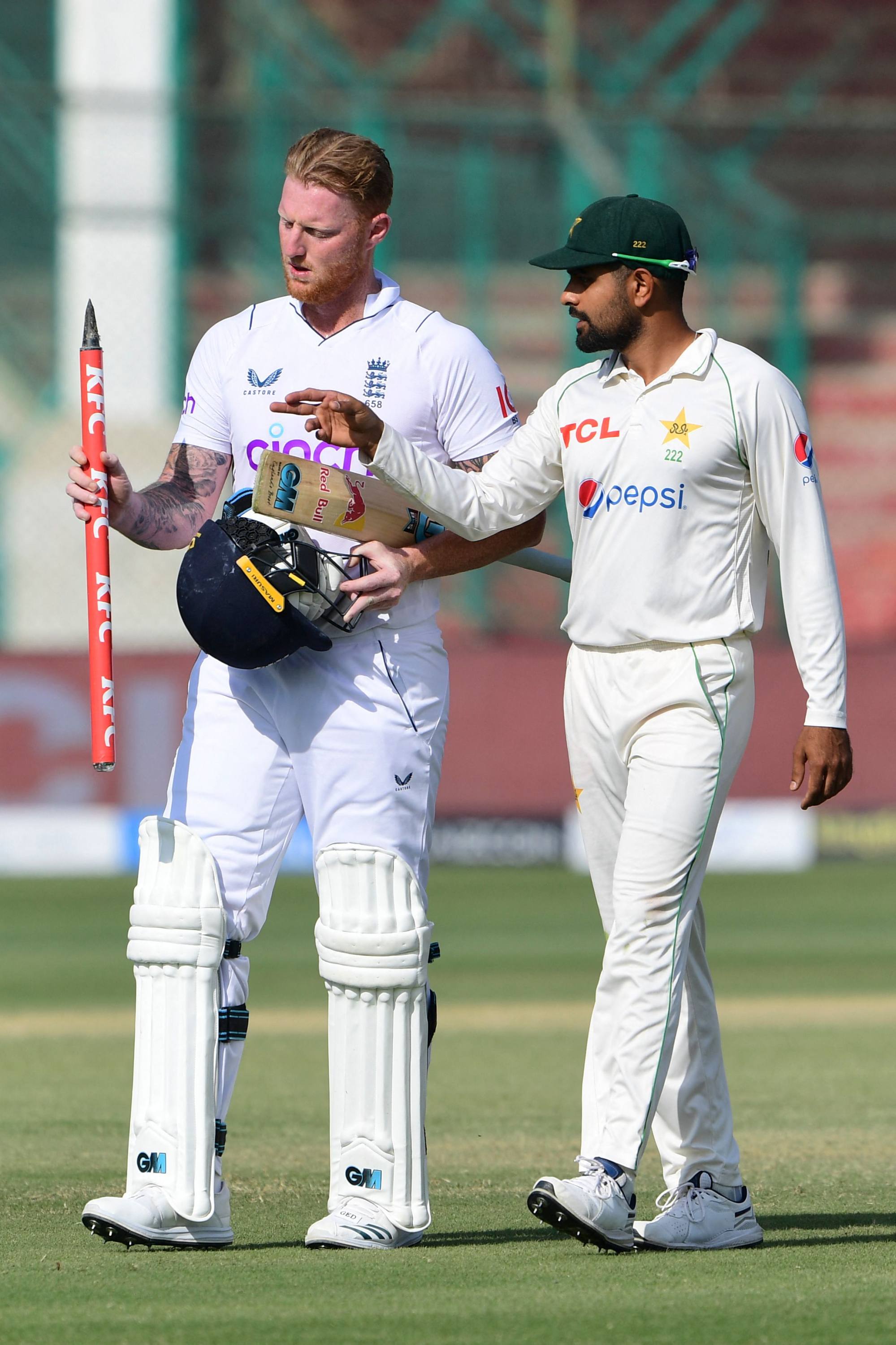 England’s captain Ben Stokes and Pakistan’s captain Babar Azam walk back at the end of third Test match between Pakistan and England at the National Stadium in Karachi. Photo: AFP