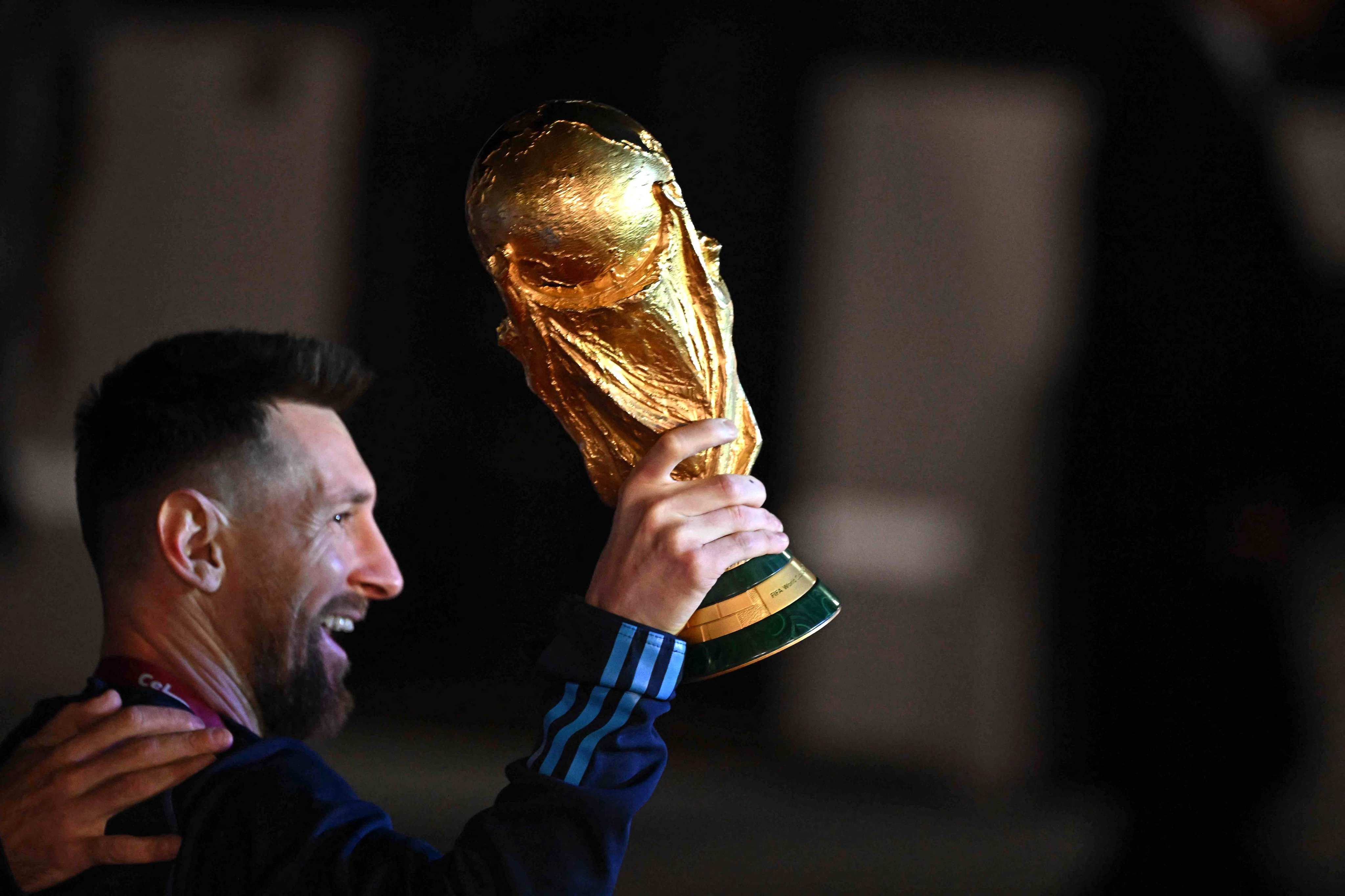 Argentina’s captain Lionel Messi holds the Fifa World Cup trophy on home soil. Photo: AFP