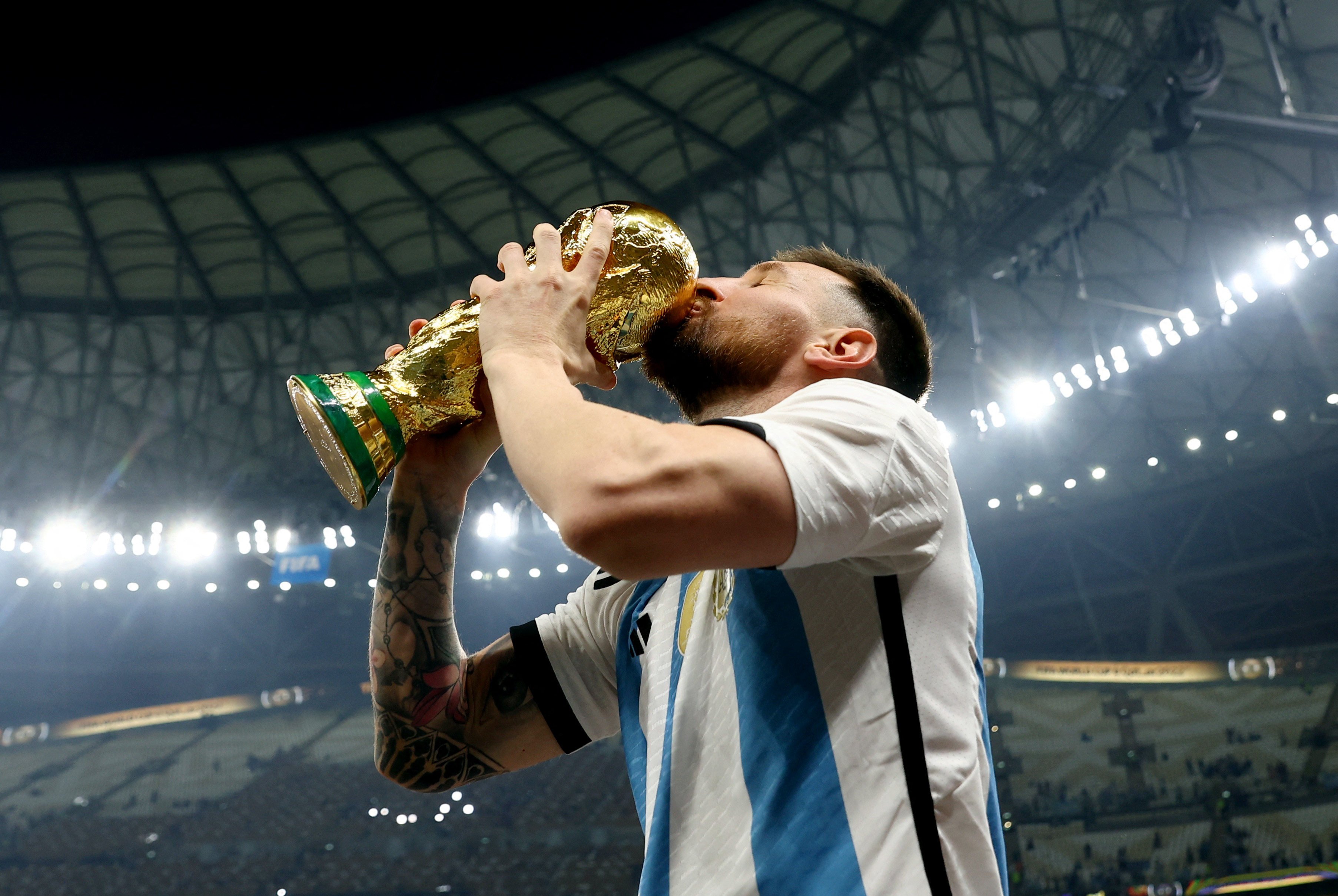 Argentina’s Lionel Messi kisses the trophy as he celebrates winning the Fifa World Cup on Sunday. Photo: Reuters