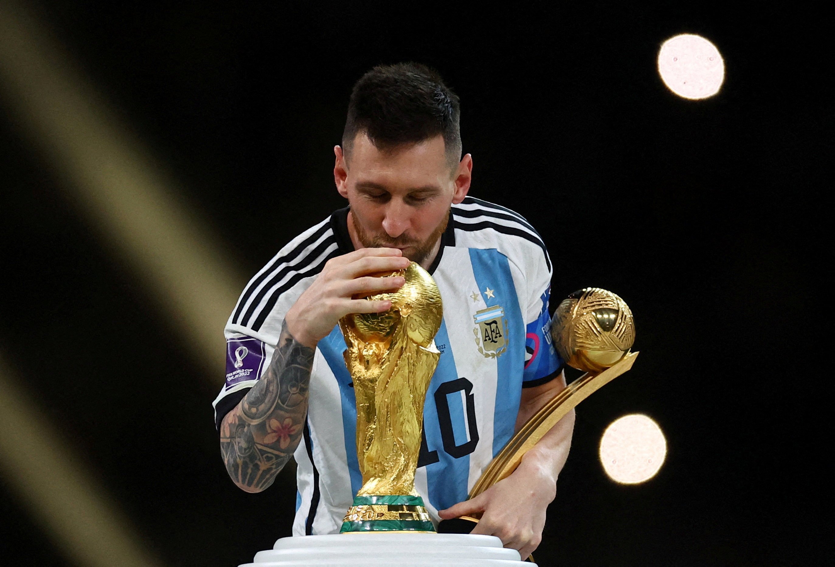 Argentina’s Lionel Messi kisses the World Cup trophy after receiving the Golden Ball award after the 2022 Fifa World Cup final. Photo: Reuters