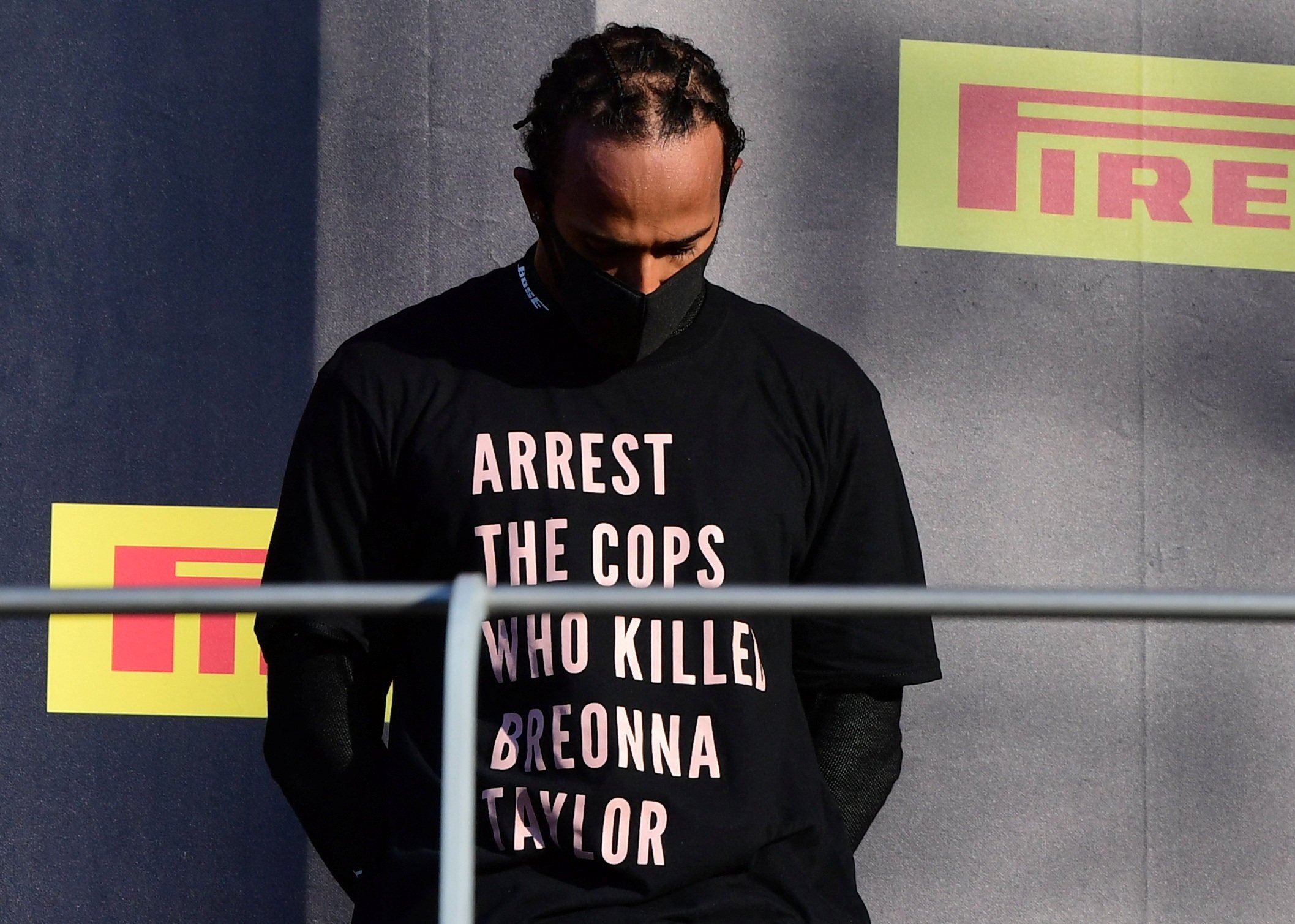 Lewis Hamilton wears a shirt in reference to Breonna Taylor on the podium after winning the Tuscan Grand Prix in 2020. Photo: Reuters