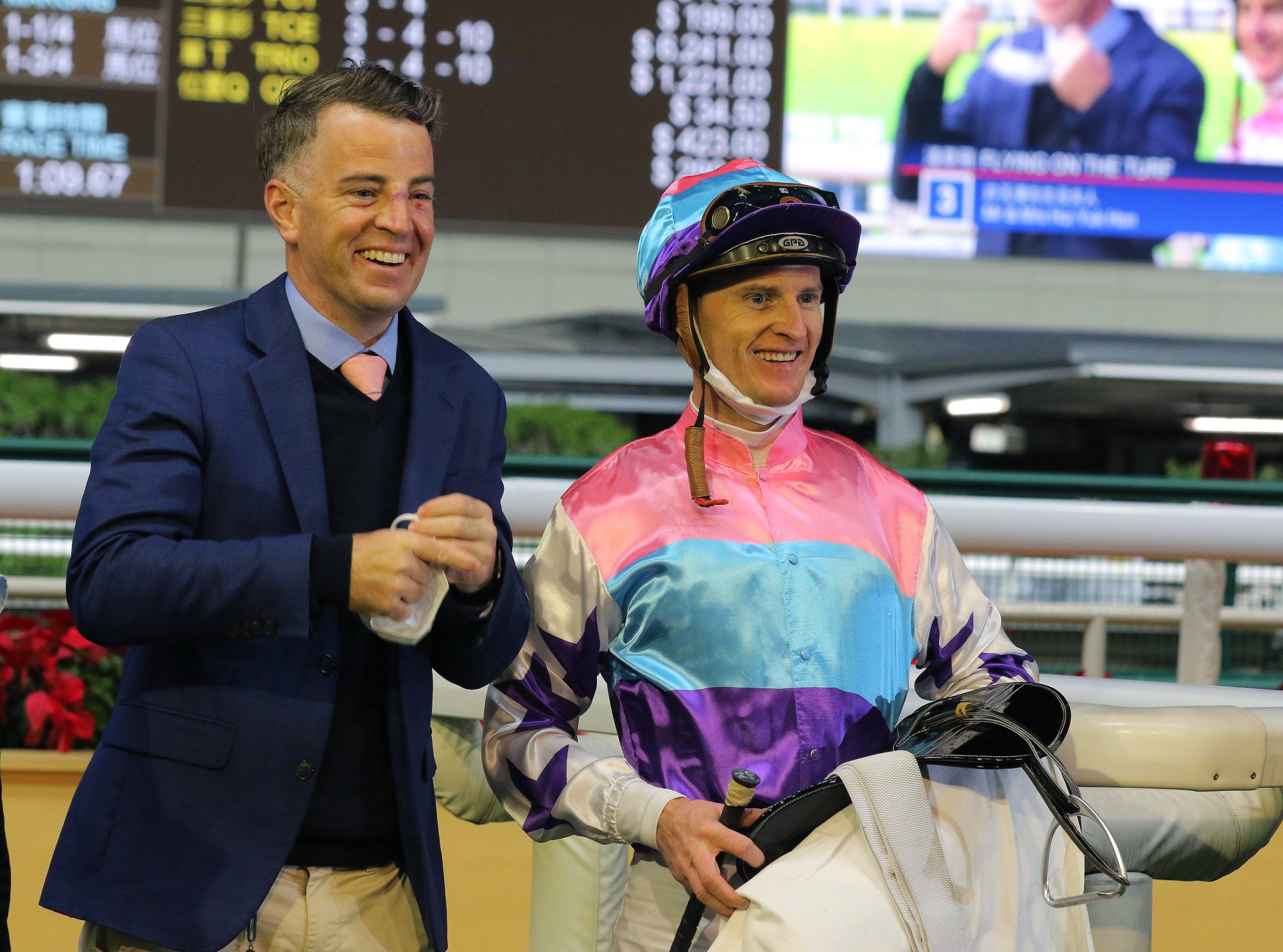 Jamie Richards and Zac Purton celebrate Flying On The Turf’s first Hong Kong victory on Wednesday night.