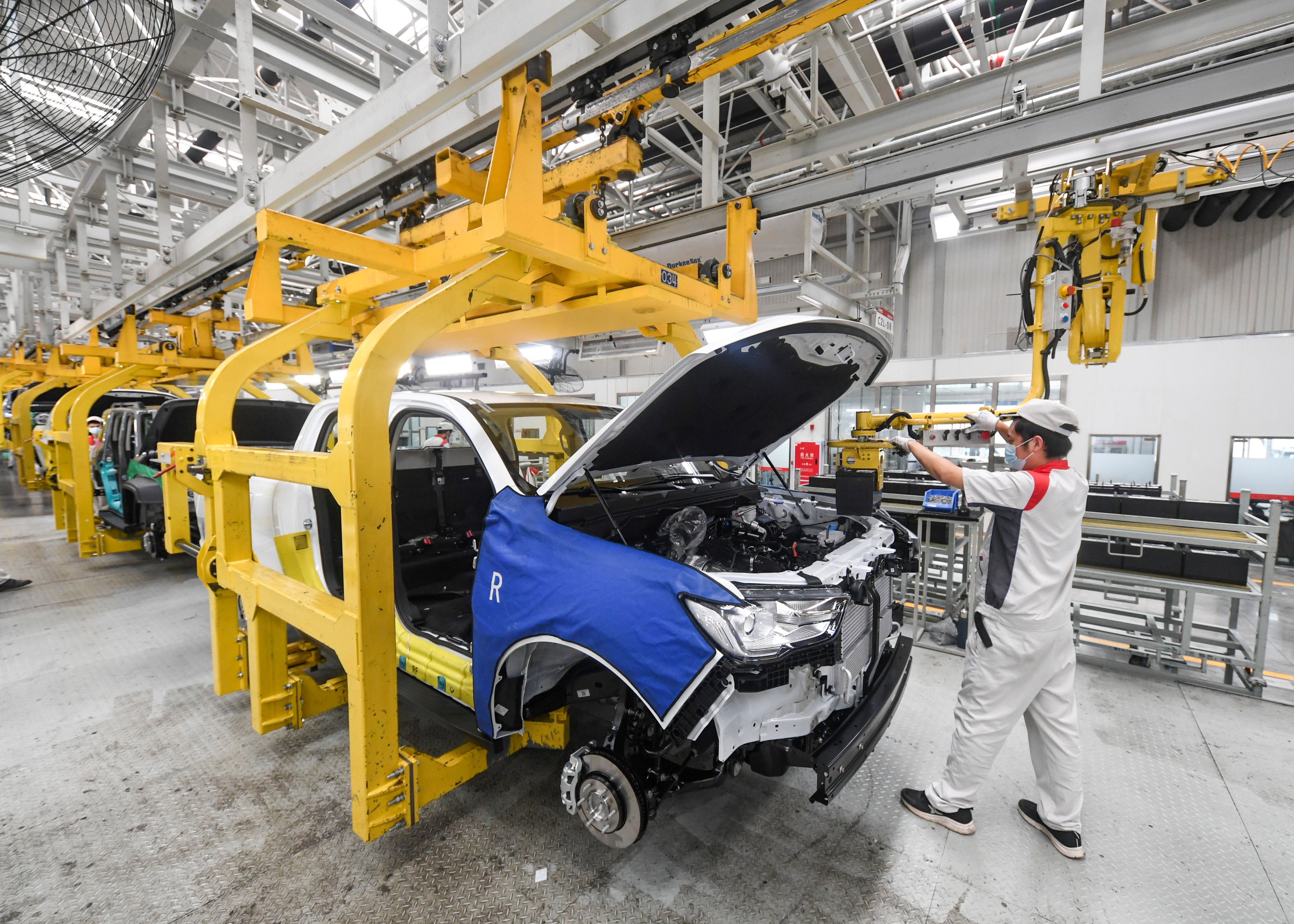 An employee works on the assembly line of Great Wall Motors in Chongqing on September 22. China’s expected recovery should be a blessing for global recovery and world trade growth in 2023 as economic activity speeds up again. Photo: Xinhua