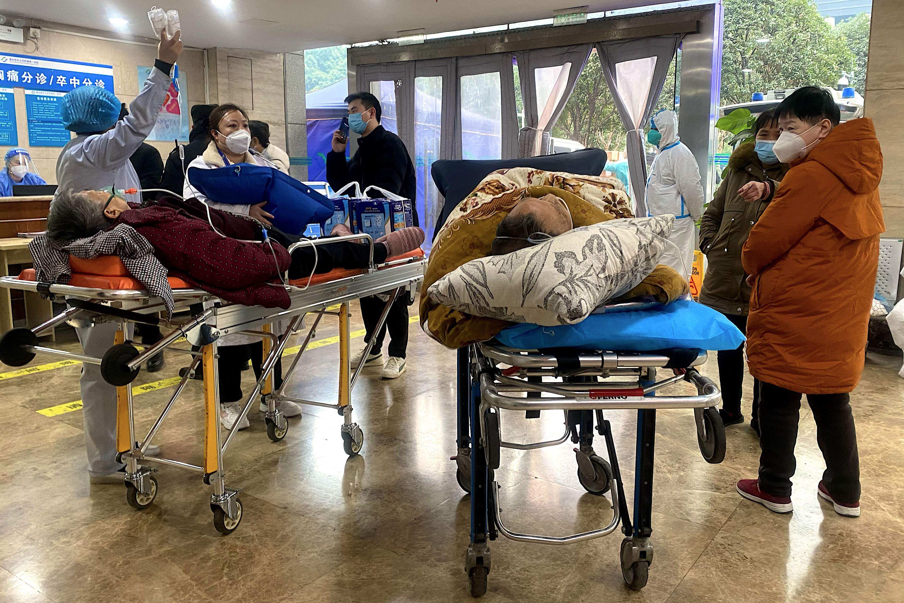 Covid-19 patients on stretchers in the emergency ward of a hospital in Chongqing, in China’s southwest, on Thursday. Photo: AFP