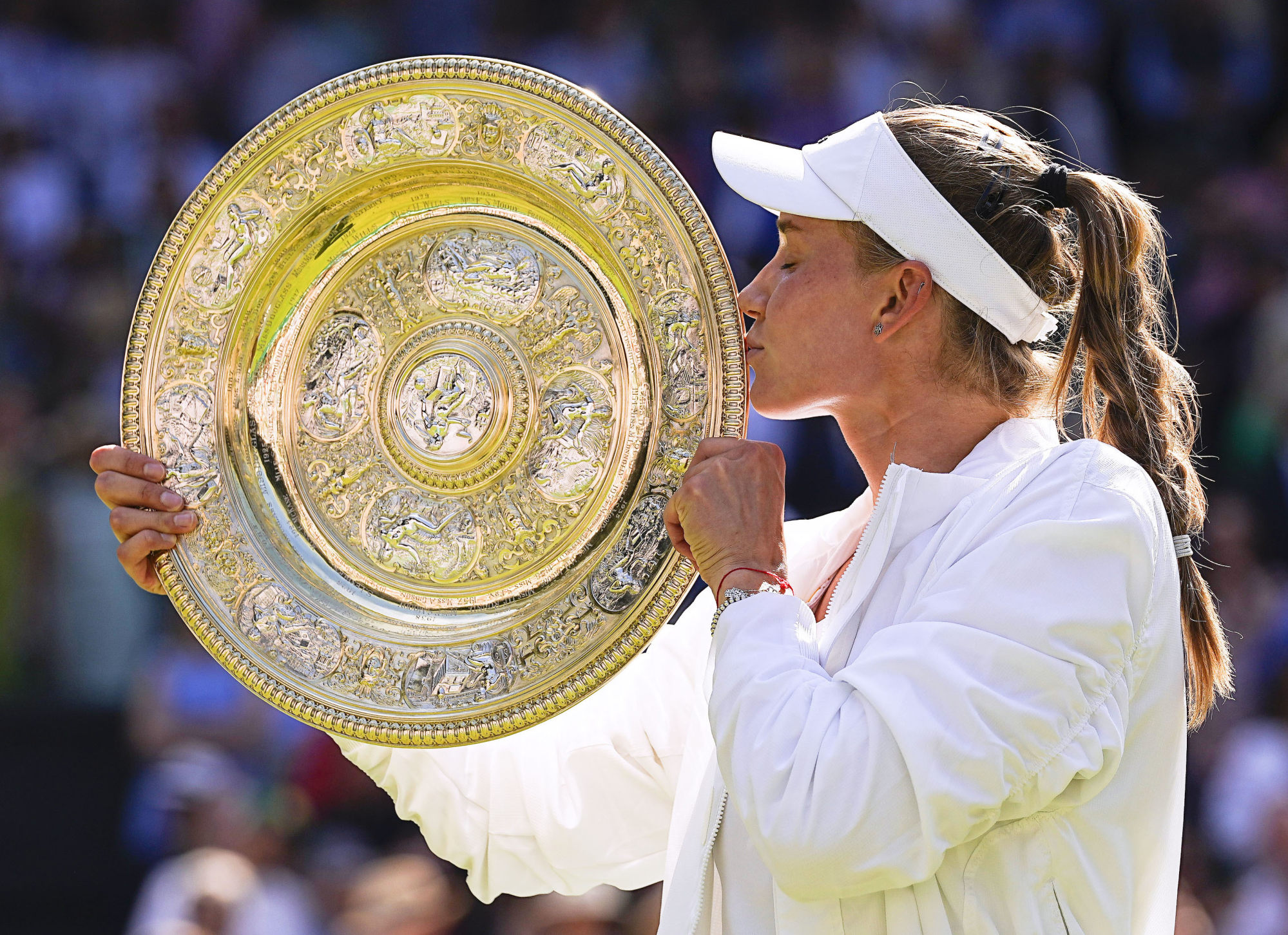 Elena Rybakina of Kazakhstan kisses the trophy after winning the women’s singles final against Ons Jabeur at Wimbledon. Photo: Kyodo