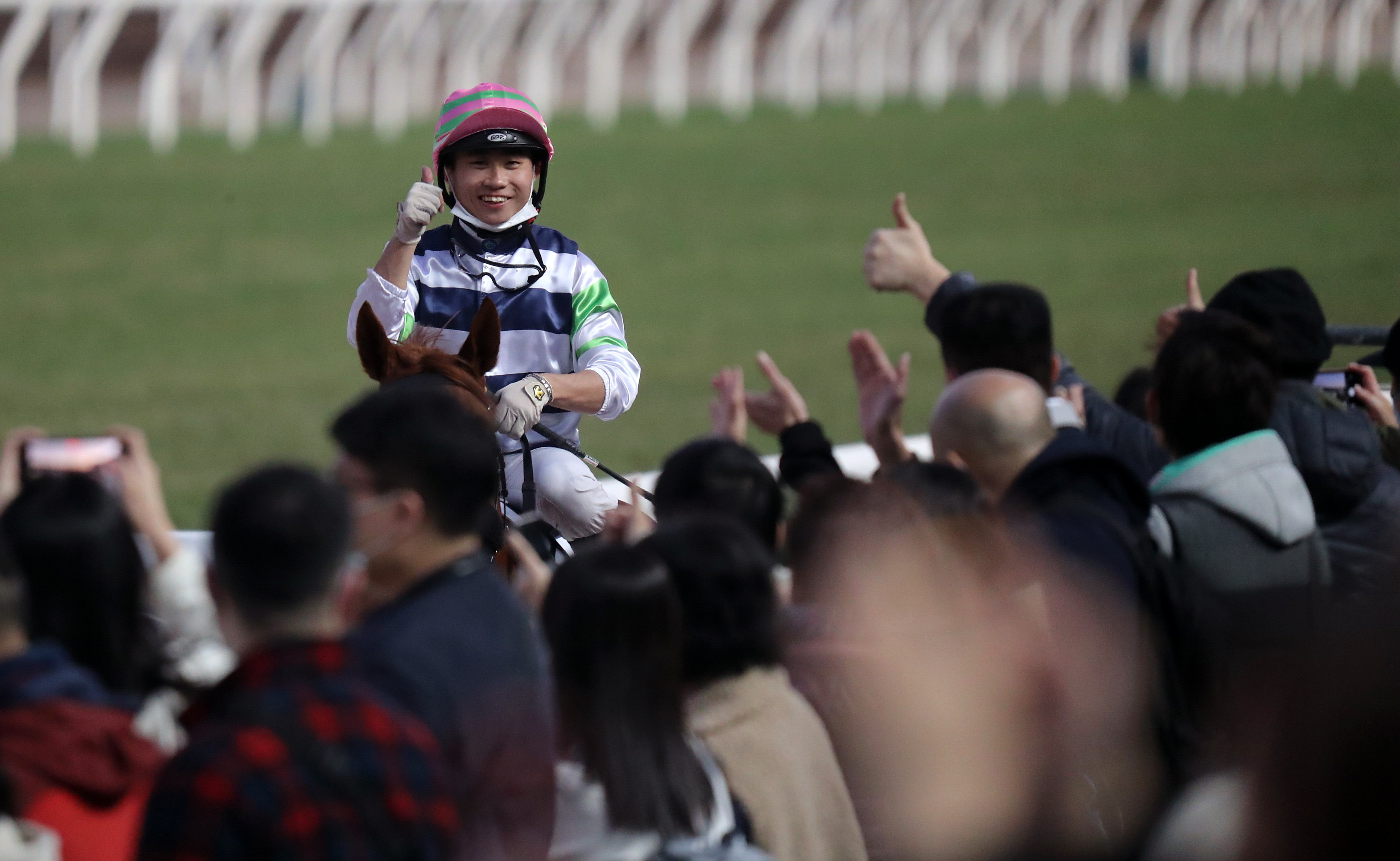 Dylan Mo enjoys the winning feeling after Packing Treadmill’s Class Two Poinsettia Handicap (1,600m) victory at Sha Tin on Saturday. Photo: Kenneth Chan
