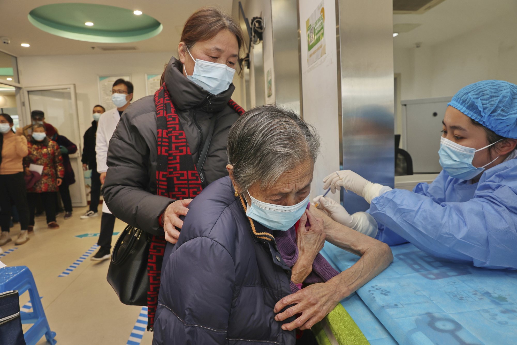 A nurse gives a Covid-19 vaccine shot to an old woman at a community health centre in Nantong in eastern China’s Jiangsu province. Photo: Chinatopix via AP