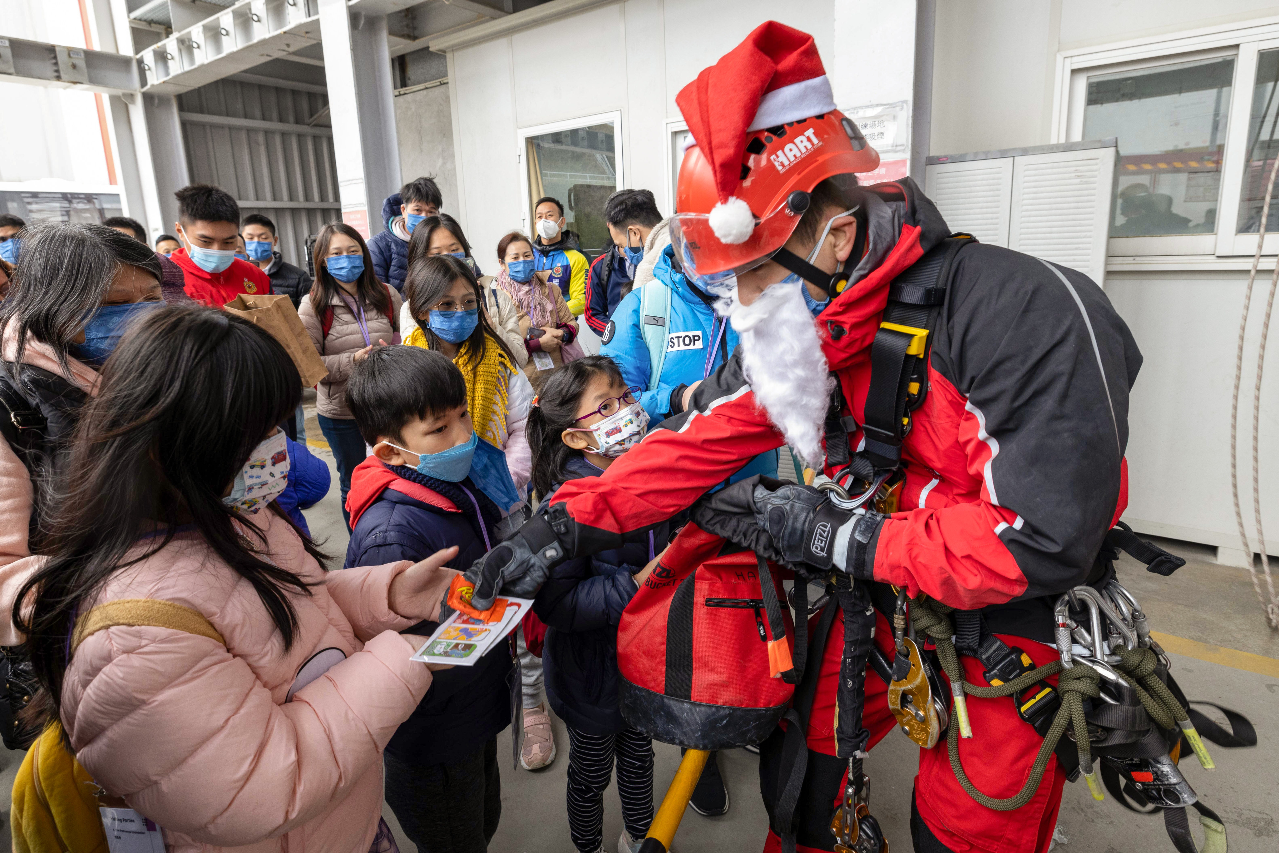 Santa Claus hands out presents to children at the Fire and Ambulance Services Academy in Tseung Kwan O. Photo: Handout