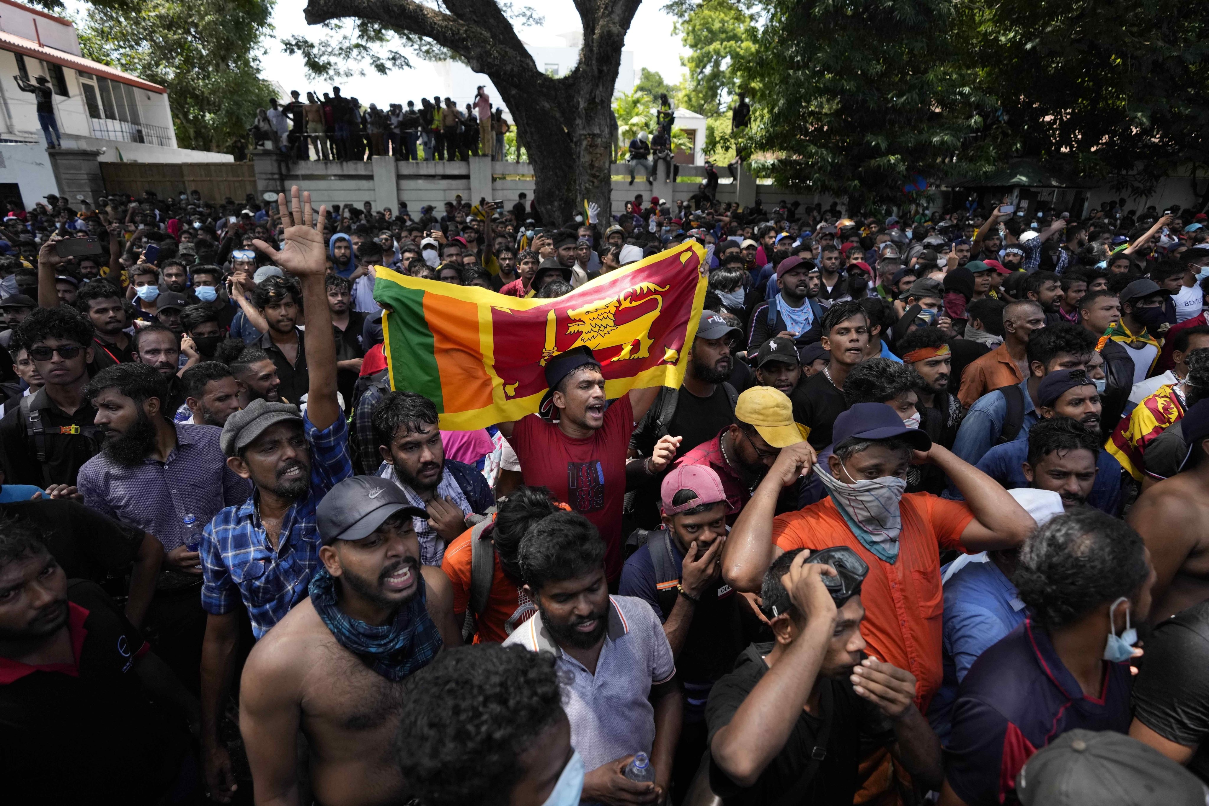 Protesters storm the office compound of Sri Lanka’s then-Prime Minister Ranil Wickremesinghe in July demanding he resign. Wickremesinghe is now president. Photo: AP