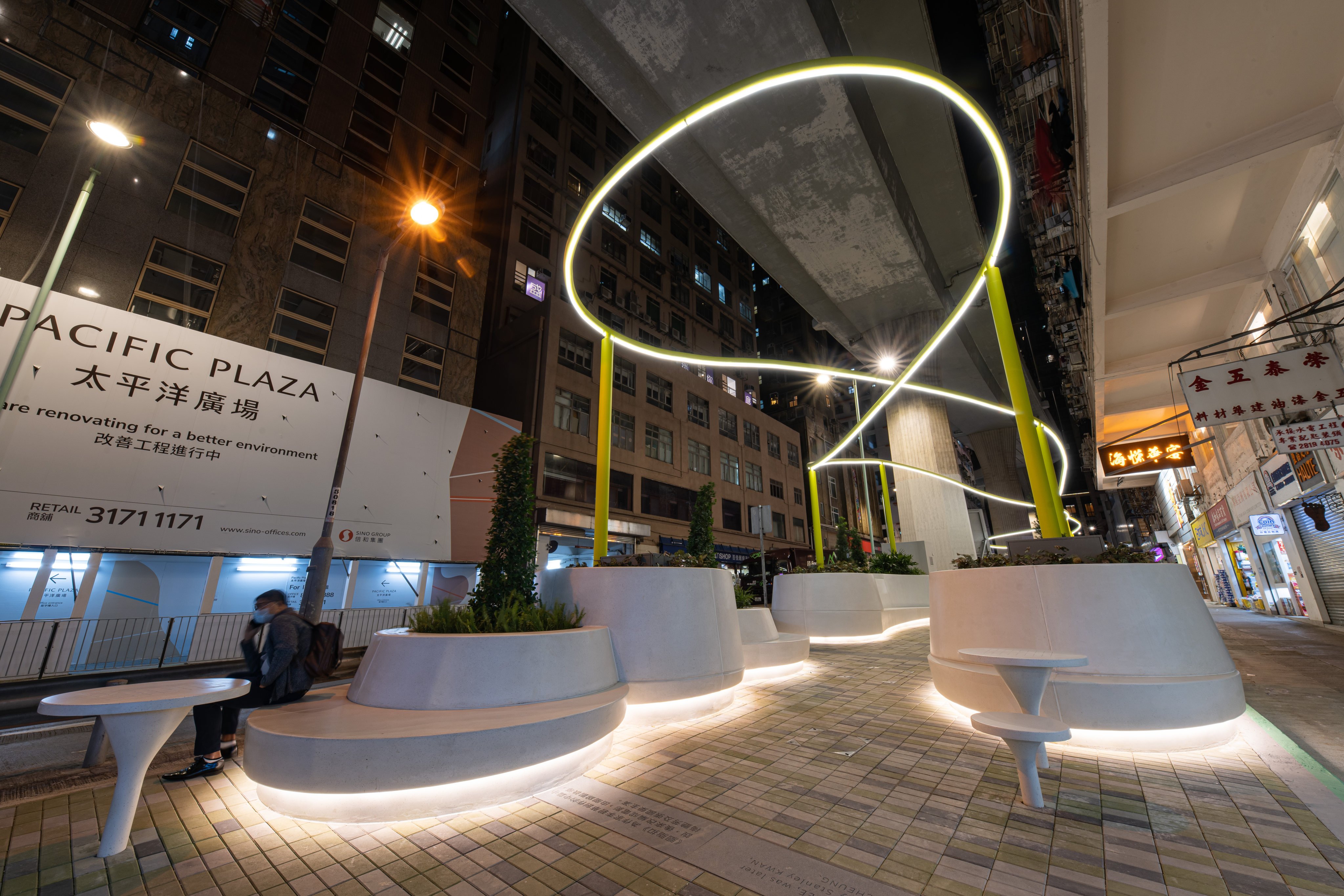 The ribbon of light from the overhead fitting at this pocket park in Shek Tong Tsui on Hong Kong Island adds drama to the renovated urban space at night. The sitting out area under the Hill Road flyover is the third of four Design Trust micro-parks. Photo: Design Trust