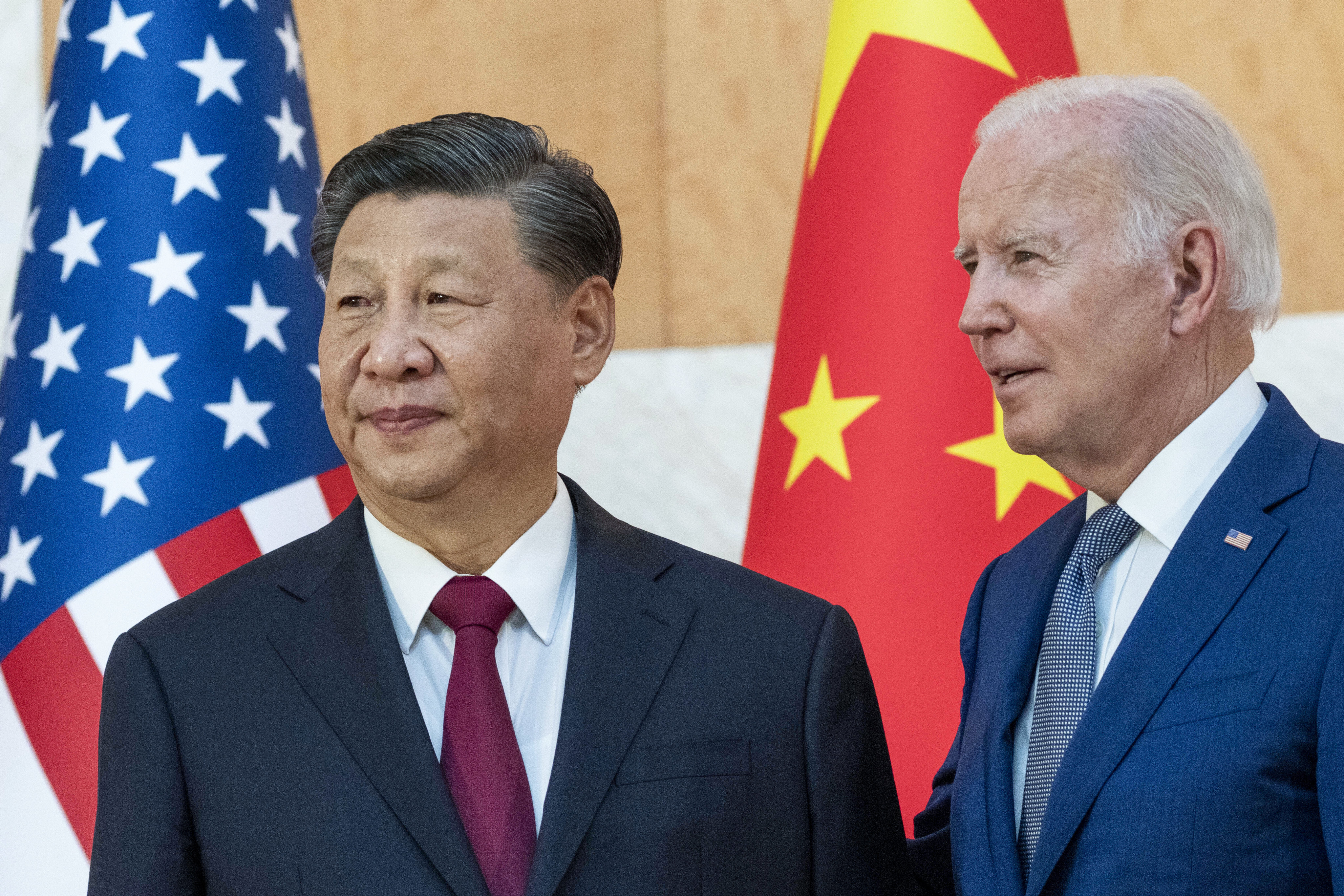 US President Joe Biden, right, stands with Chinese President Xi Jinping at the G20 summit in Bali, November 2022. Photo: AP