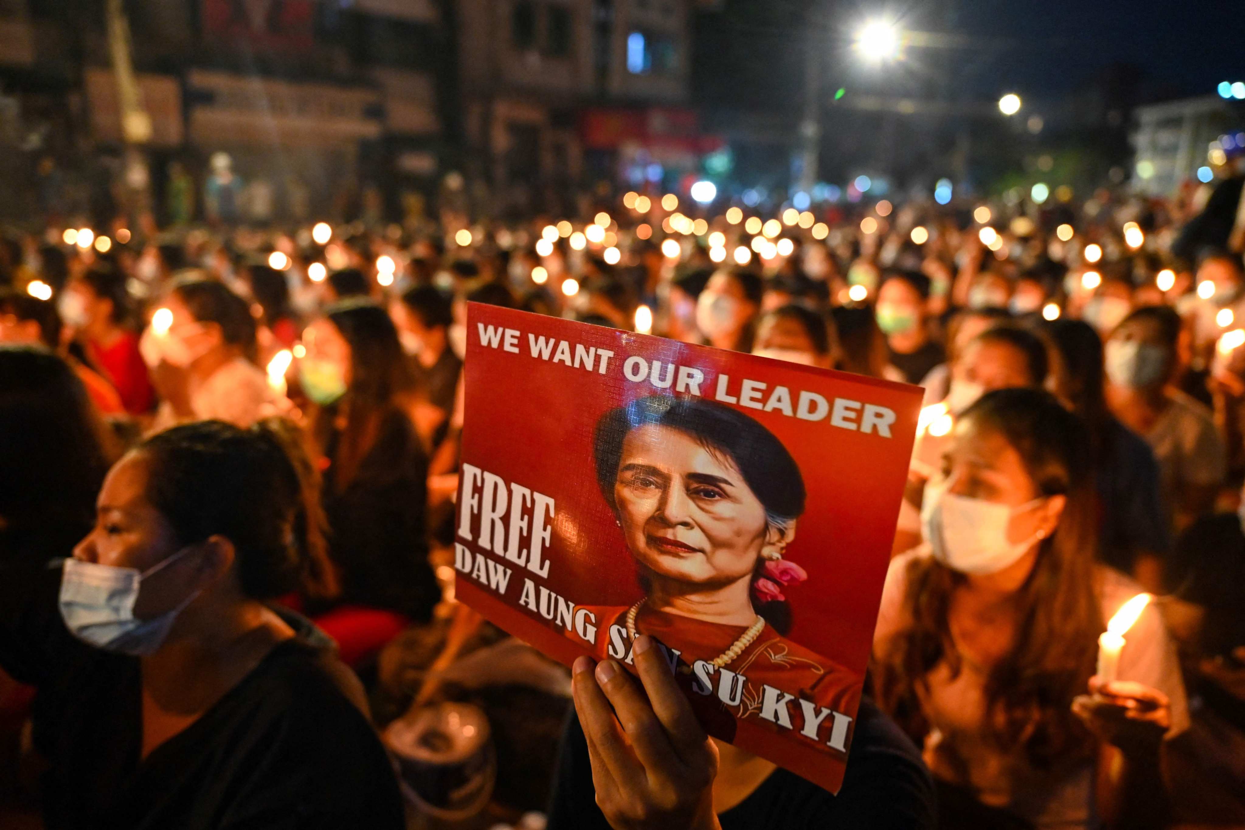 A protester holds up a poster featuring Aung San Suu Kyi during a demonstration against the military coup in Yangon. File photo: AFP