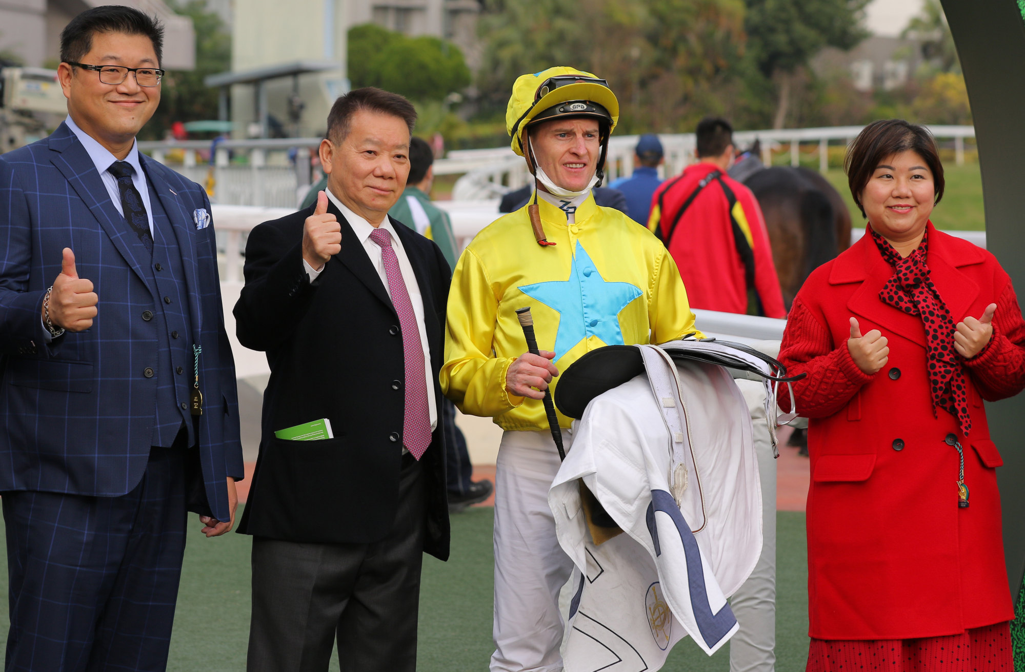 Lucky Sweynesse’s connections, including Manfred Man and Zac Purton, celebrate his Group Three win on Sunday.