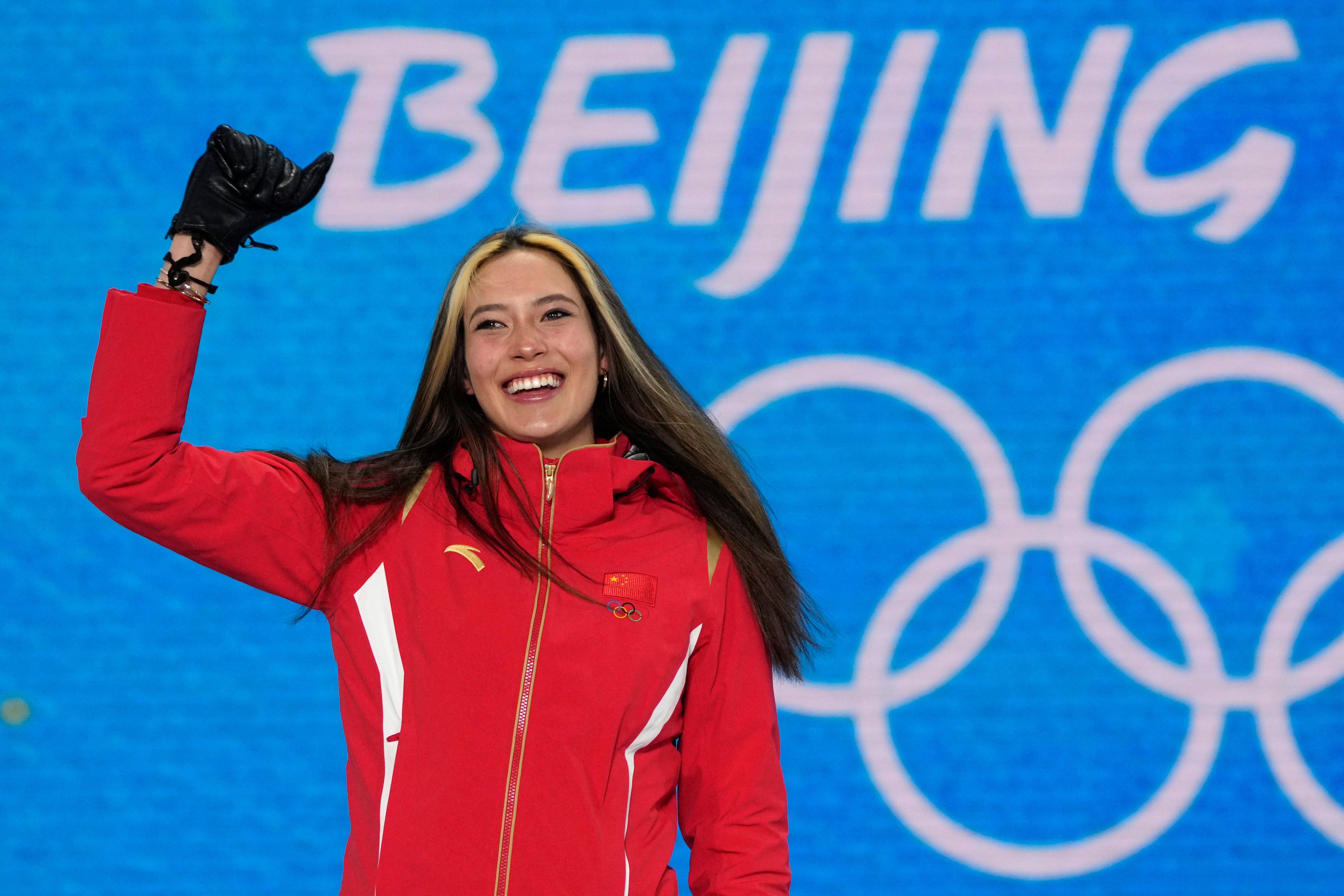 China’s Eileen Gu celebrates during a medal ceremony for the women’s freestyle skiing halfpipe at the 2022 Winter Olympics. Photo: AP