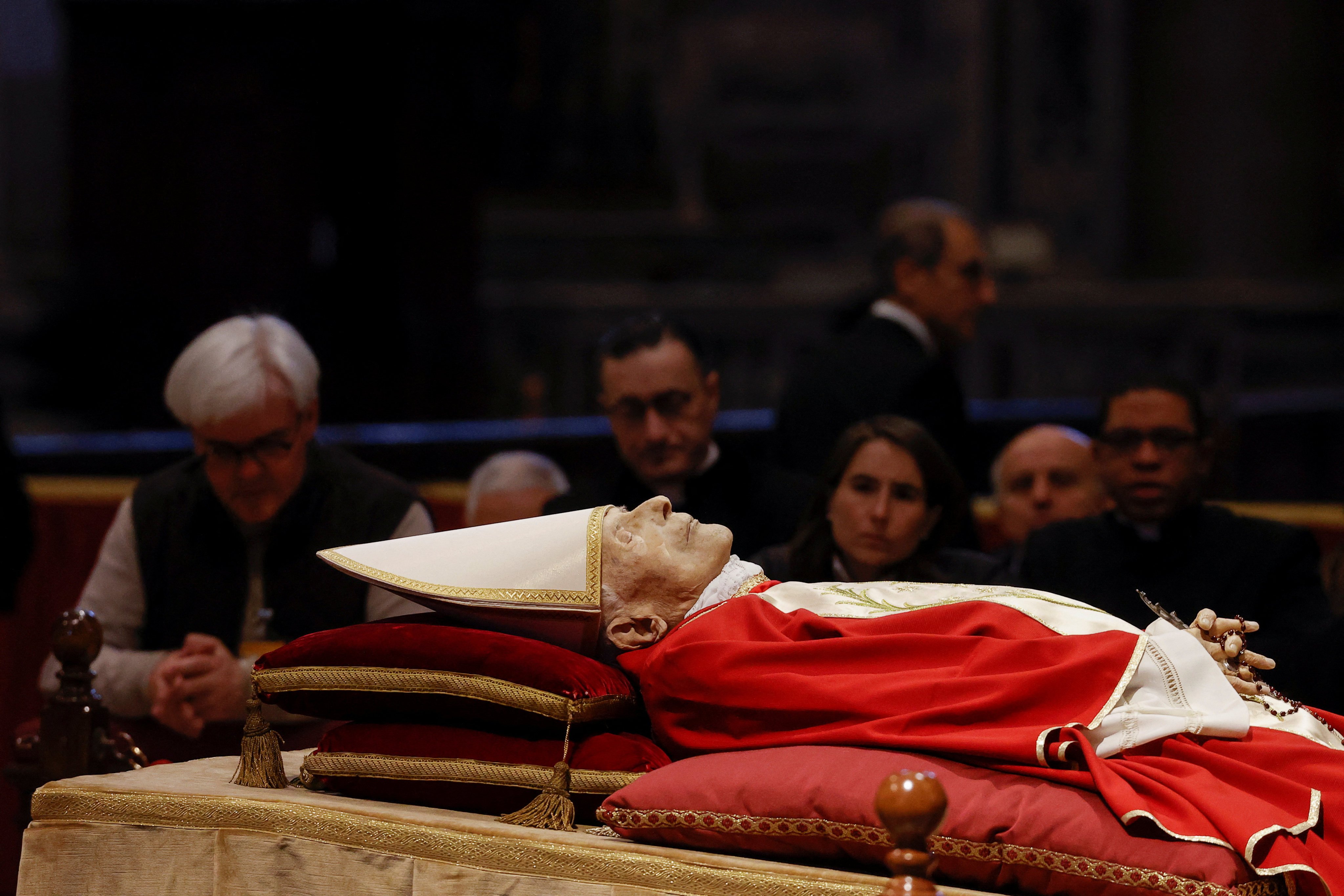 People pay homage to former Pope Benedict in St. Peter’s Basilica at the Vatican, after his death at 95. Photo: Reuters