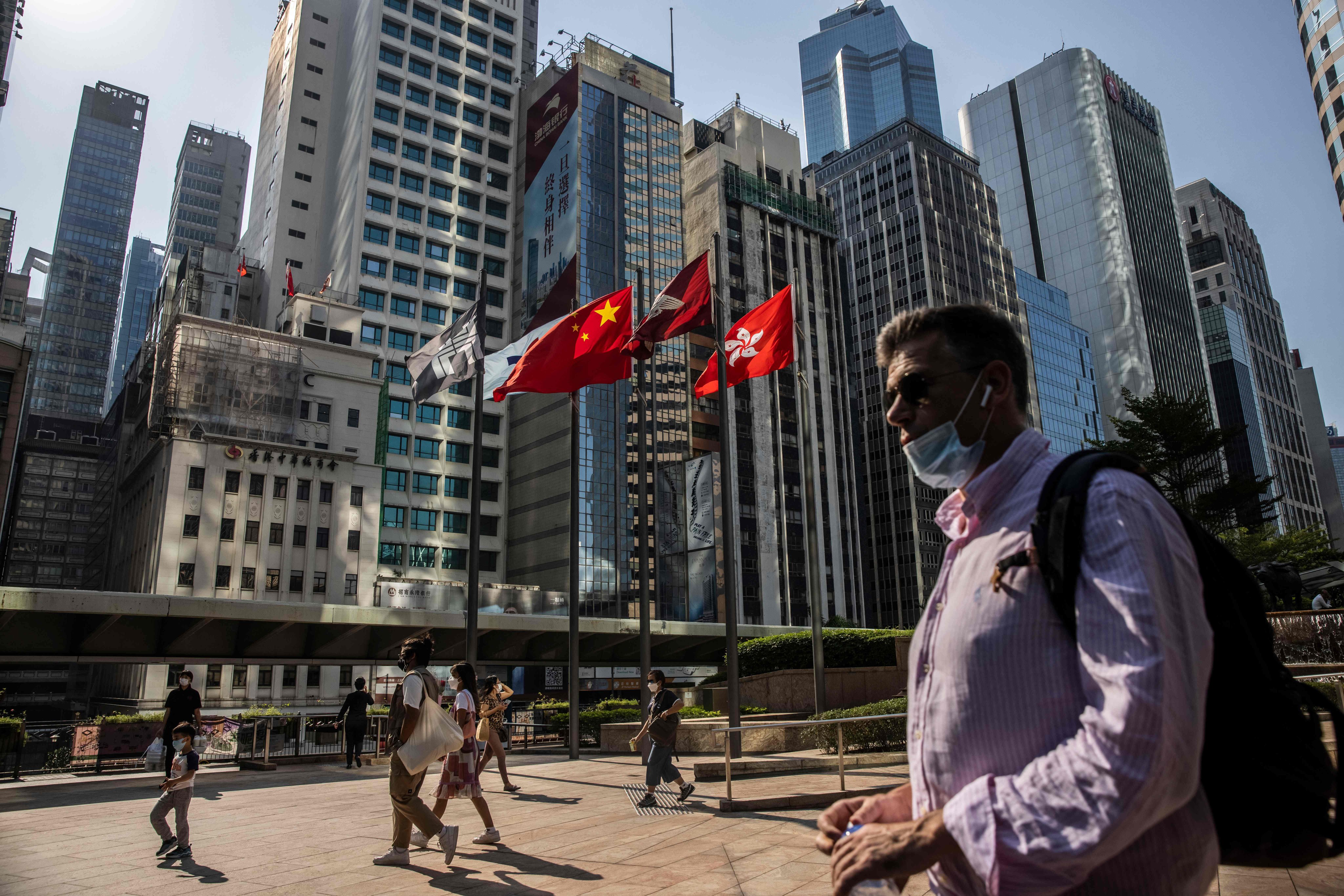 People walk through Exchange Square, the home of the Hong Kong stock exchange, on October 28 last year. Photo: AFP