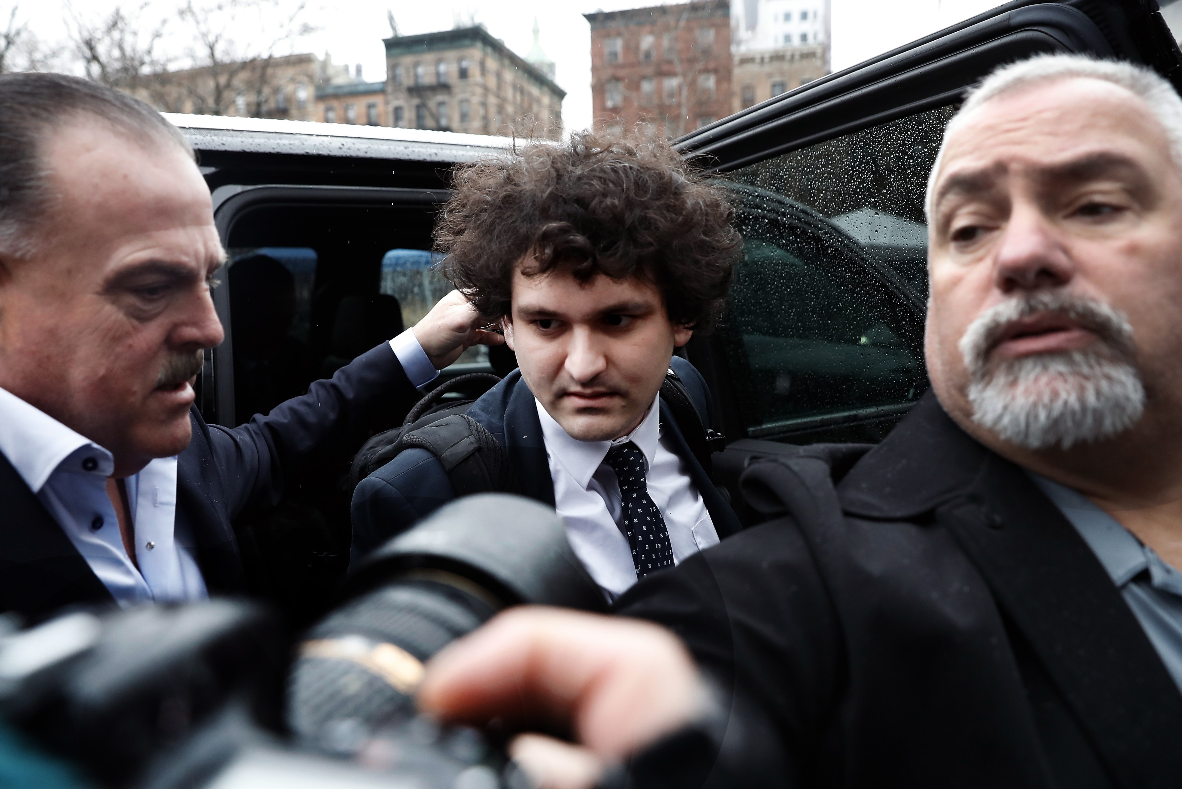 Cryptocurrency entrepreneur Sam Bankman-Fried (centre) arrives for a plea hearing in New York on Tuesday. Photo: EPA-EFE