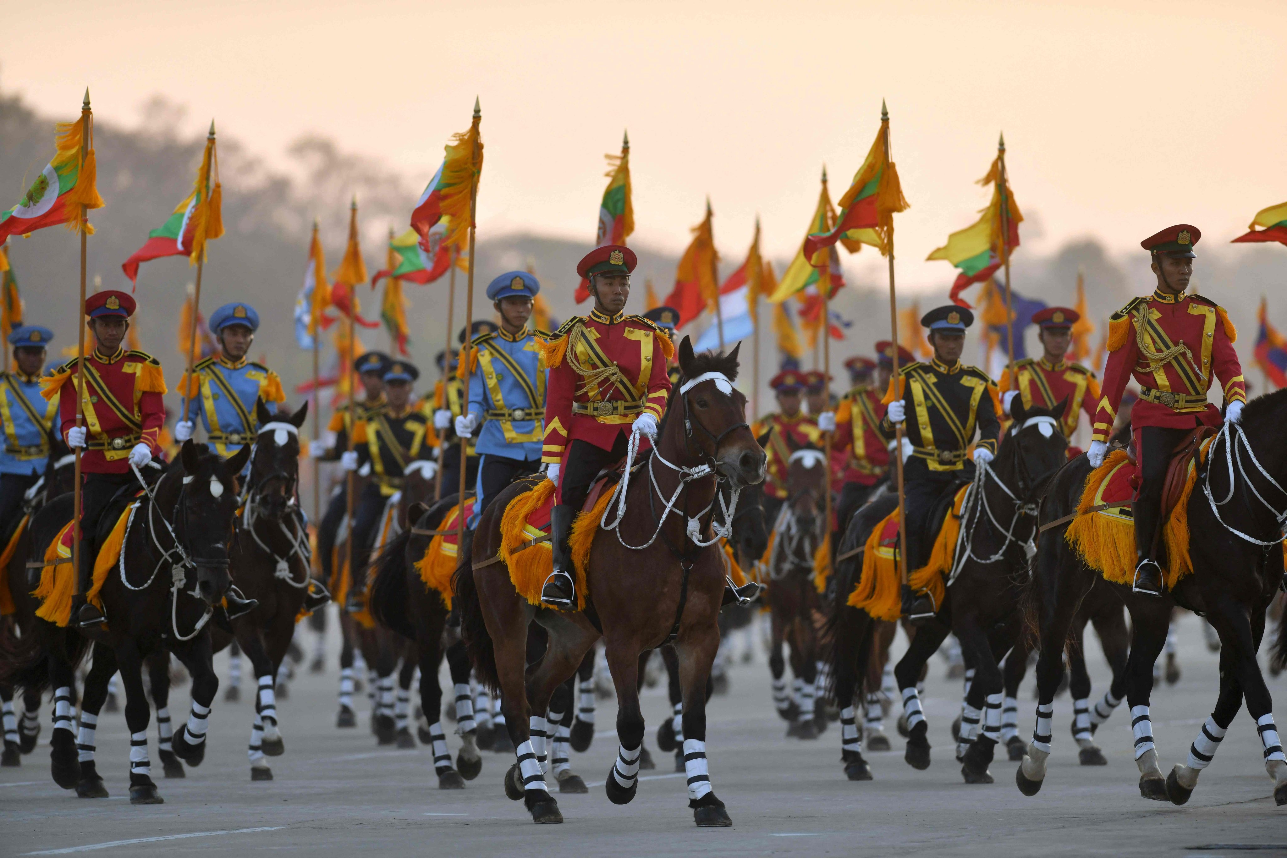 Soldiers on horseback lead the convoy of Myanmar military chief Min Aung Hlaing as he arrives at the parade ground to mark the country’s independence day in Naypyidaw on January 4, 2023. Photo: AFP